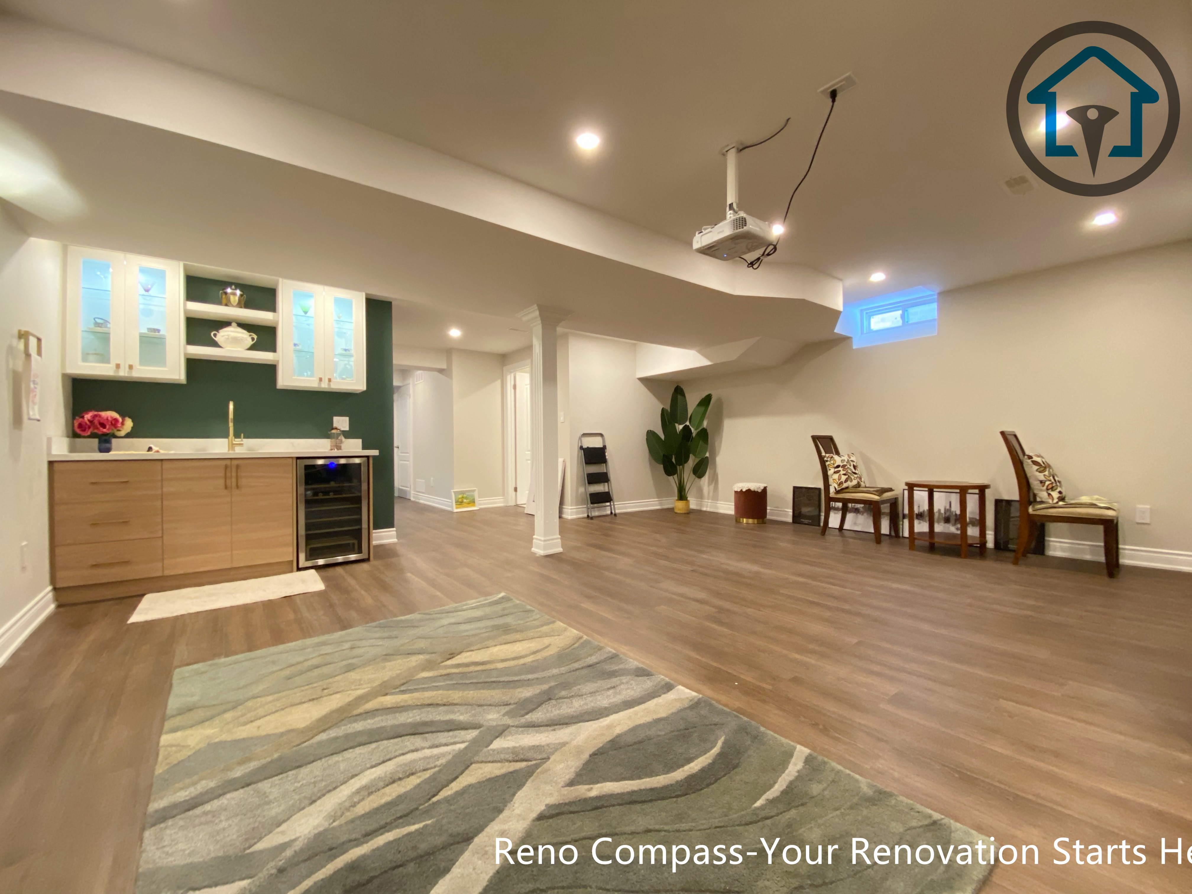 Basement interior renovation in Markham showcasing wood accent panels, soft ambient lighting, and a modern color palette that enhances depth and comfort.