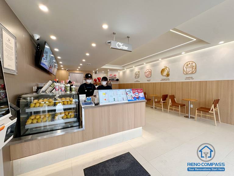 This North York bubble tea shop renovation features a modern front counter design, upgraded display area, and optimized seating layout for a smooth customer experience. Completed by a professional Toronto renovation company, the commercial space combines clean finishes, bright lighting, and functional workflow to support high-volume beverage service and daily operations.