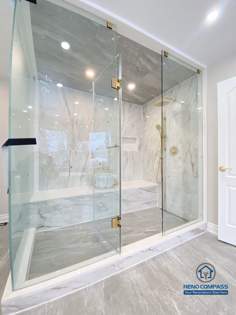 This Richmond Hill bathroom renovation showcases a bright and elegant design featuring a frameless glass shower enclosure