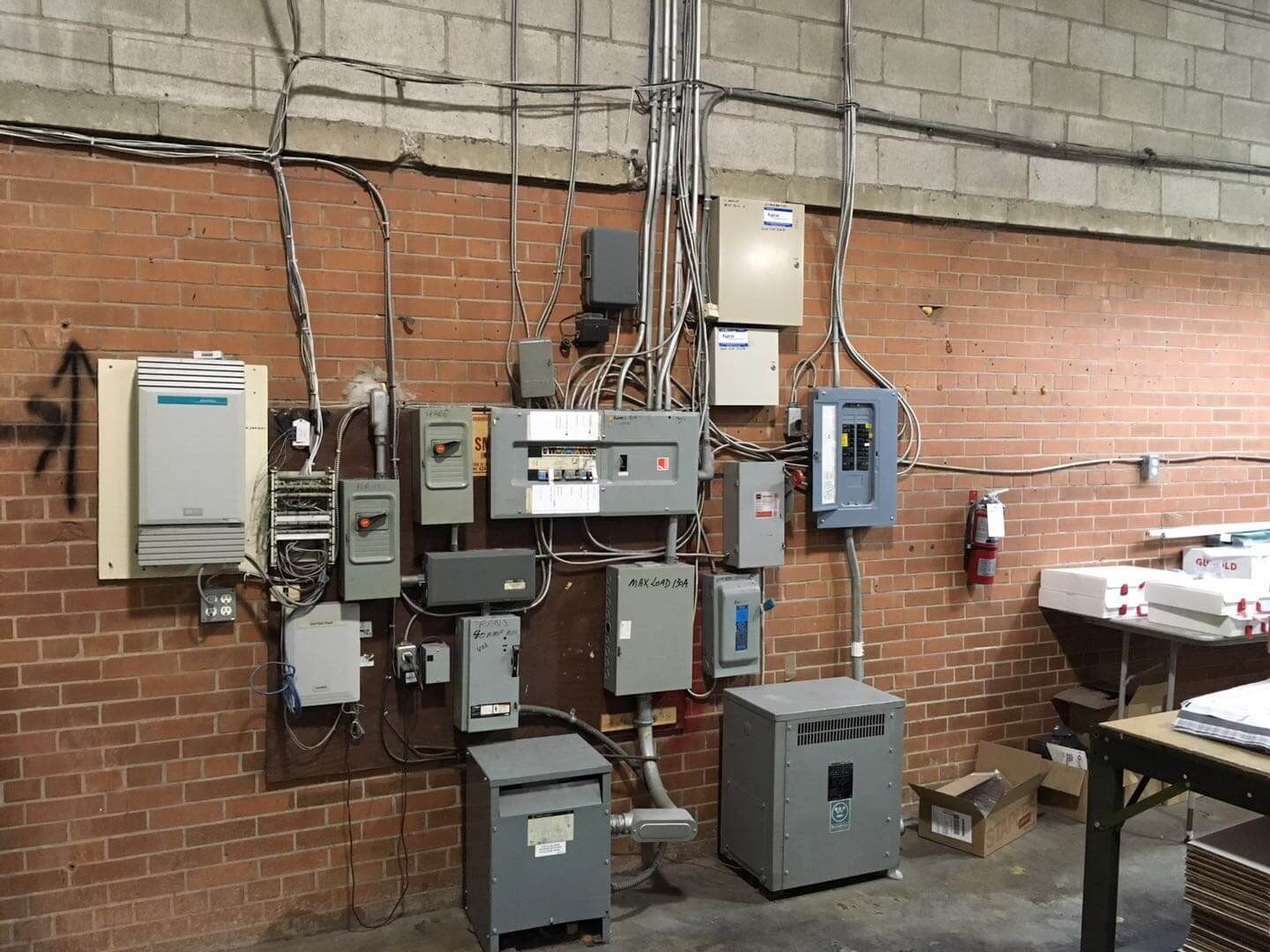 This Toronto factory renovation project showcases a professional industrial electrical system upgrade completed by Reno Compass Inc. The image highlights organized electrical panels, conduit installation, and upgraded power distribution systems designed to improve safety, efficiency, and long-term functionality within a commercial factory environment. As an experienced Toronto renovation company specializing in industrial and commercial spaces, Reno Compass ensures all mechanical and electrical components meet modern standards while supporting heavy-duty operational needs.