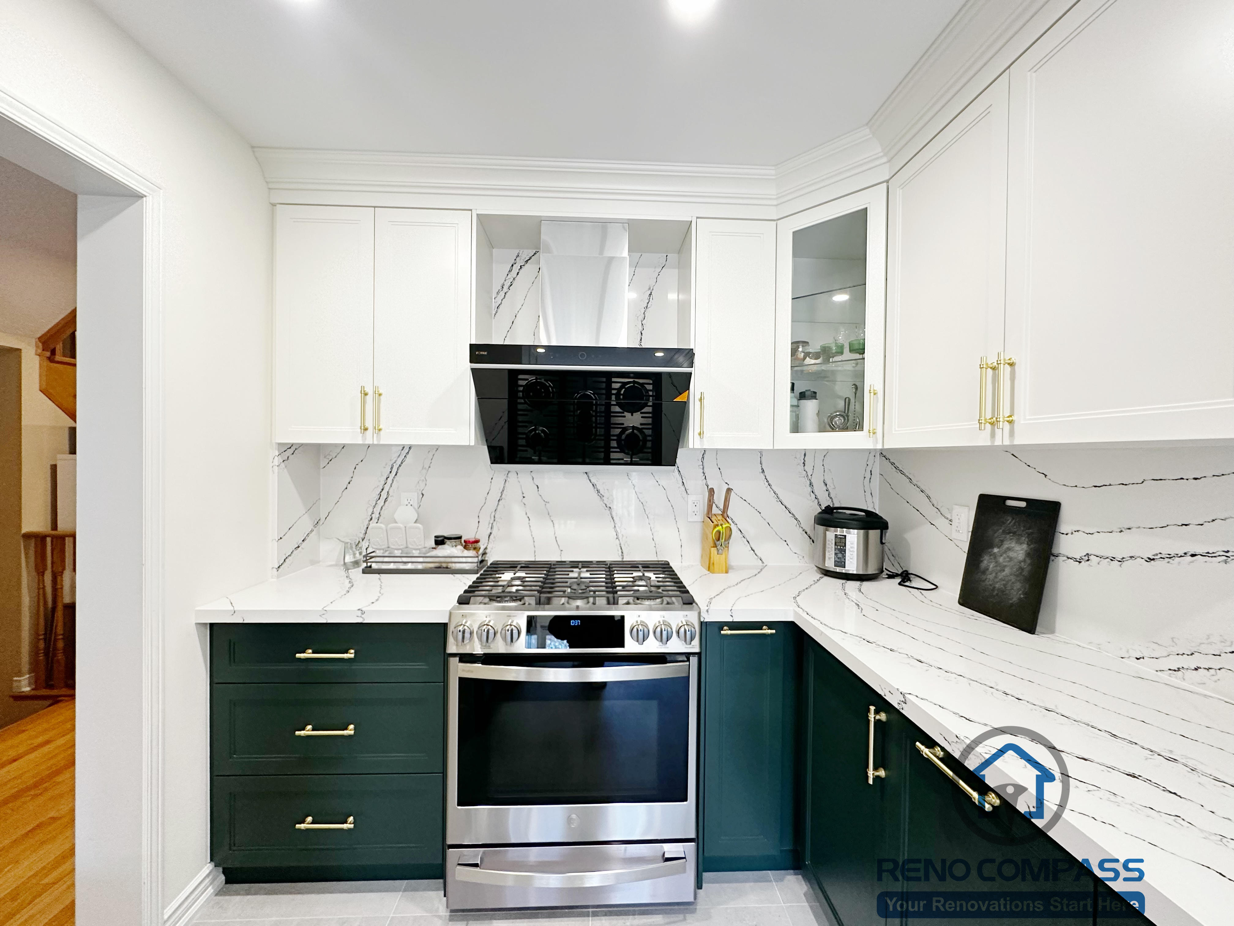 This Mississauga kitchen renovation highlights a central cooking zone featuring a stainless steel range, custom cabinetry, pull-out spice storage, and a built-in range hood. The design improves cooking efficiency, organization, and ventilation while maintaining a clean and cohesive kitchen layout.