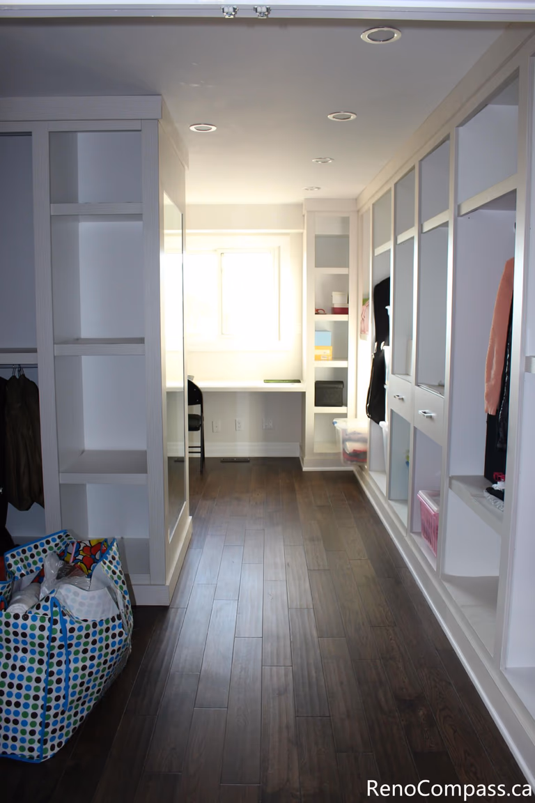 This custom walk-in closet and storage area is part of a full house renovation project in Mississauga completed by a professional Toronto renovation company. Featuring built-in shelving, wardrobe storage, and modern lighting, the space is designed to improve organization and maximize functionality. The renovation enhances daily convenience while creating a clean, bright, and well-structured interior that adds both comfort and value to the home.