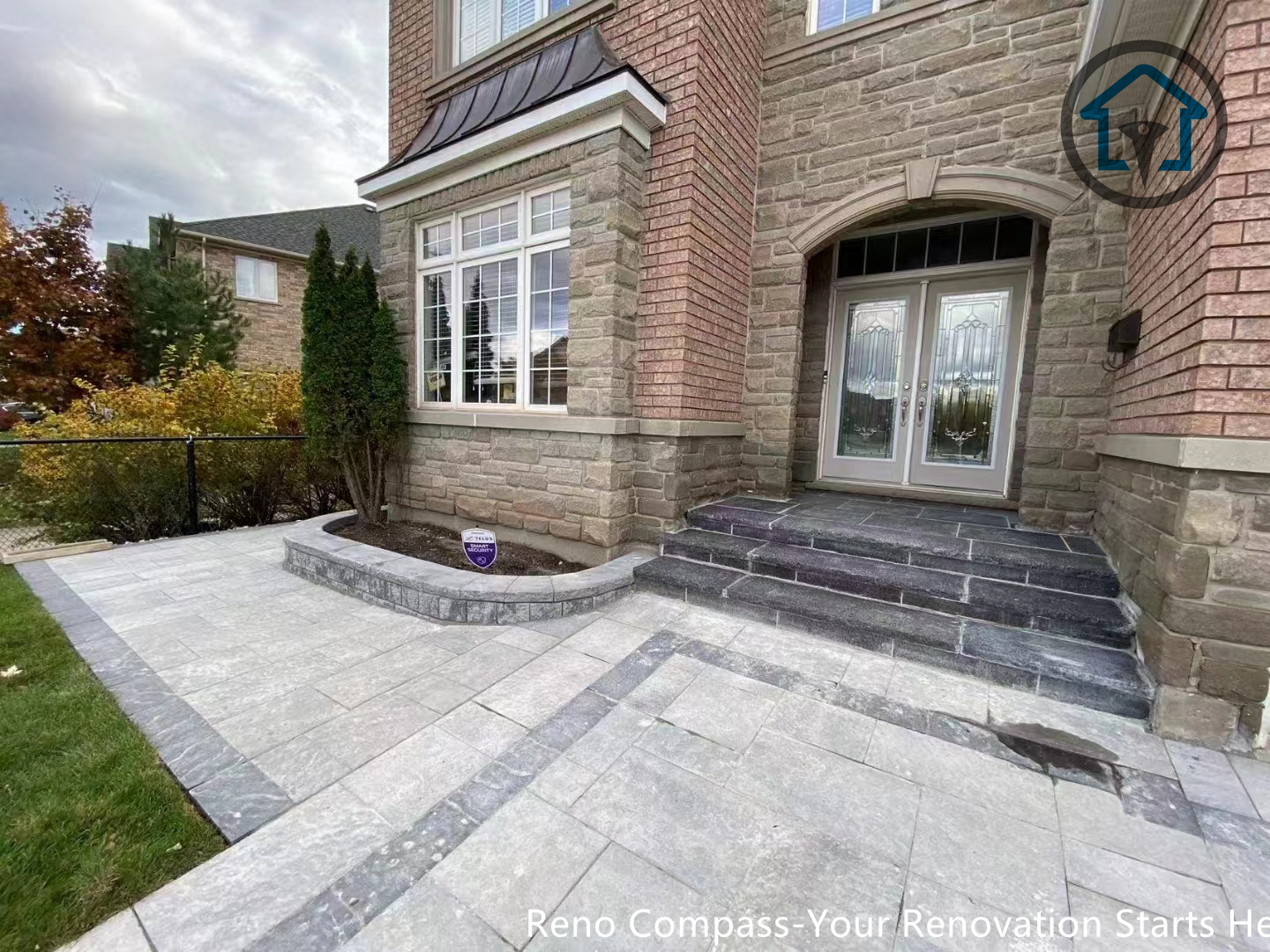 This image features a front entrance patio paving project in Oakville, combining interlocking stones with a practical layout that improves accessibility and outdoor usability. The design complements the home’s architecture and enhances curb appeal. Completed by Reno Compass Inc.