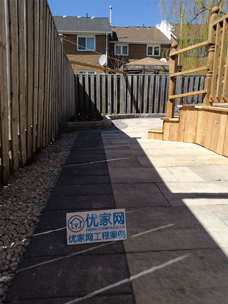 This Richmond Hill landscaping renovation features a newly installed stone walkway designed to improve accessibility and enhance the side yard’s overall appearance. Large-format interlocking pavers create a clean, modern pathway between the fence and exterior wall, while proper grading and gravel drainage ensure durability and low maintenance. The project focuses on functionality, safe drainage, and a polished outdoor finish, transforming a narrow side yard into a practical and visually appealing landscape feature for everyday use.