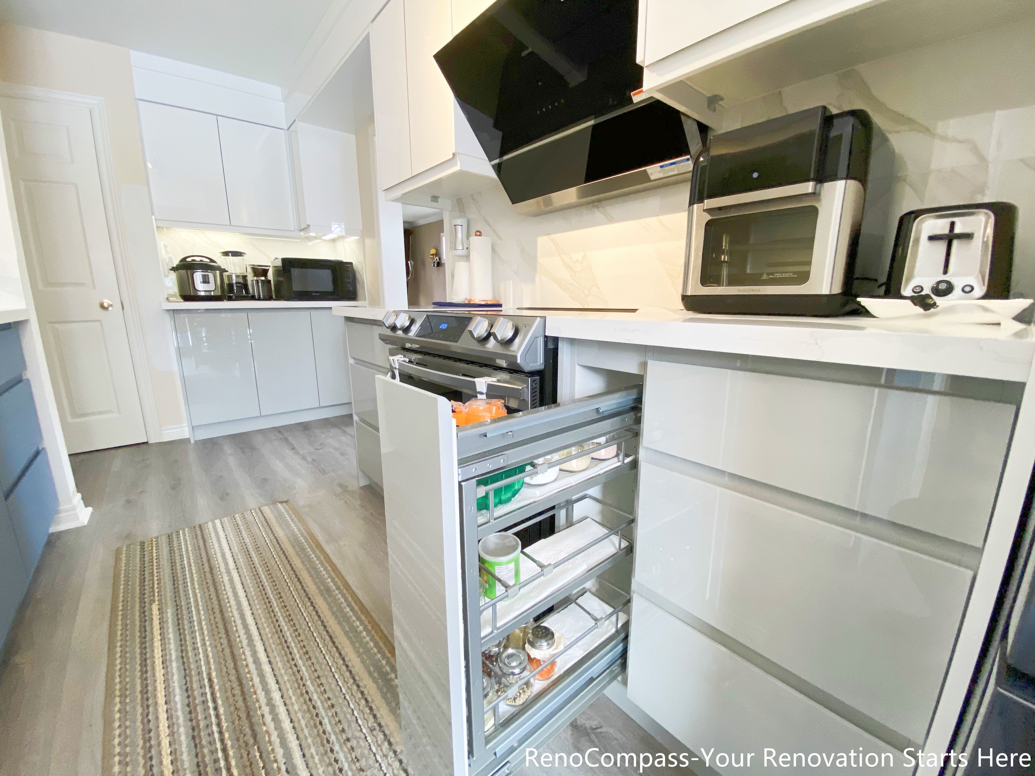 This image highlights a pull-out pantry cabinet installed as part of a Mississauga kitchen renovation. The tall, narrow pull-out unit provides easy-access storage for pantry items, condiments, and small kitchen essentials. Full-extension sliding hardware allows clear visibility and smooth operation, improving daily usability and organization. Integrated seamlessly into the surrounding cabinetry, this storage solution maximizes space efficiency while maintaining a clean and modern kitchen layout.