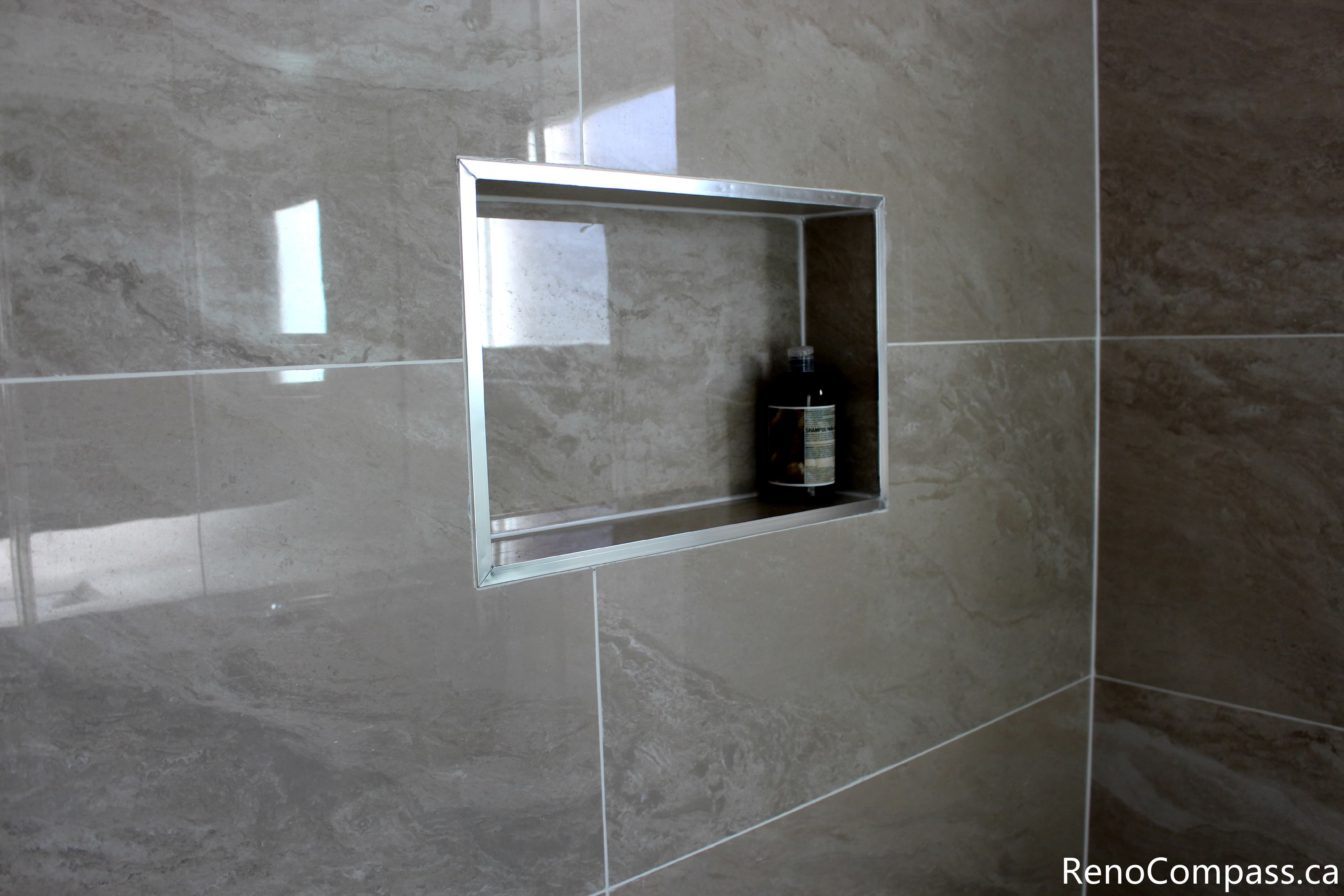 This Mississauga bathroom renovation highlights the shower wall tile installation using large-format tiles. The neutral tones and precise alignment create a refined, contemporary look while ensuring durability and easy maintenance.