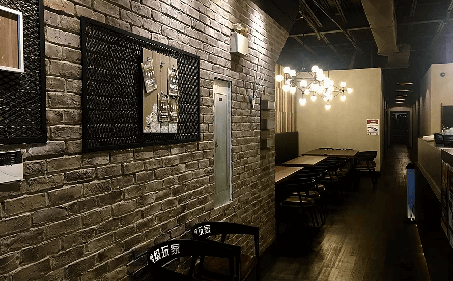 This Toronto commercial interior design project highlights a stylish restaurant and lounge space featuring exposed brick walls, warm ambient lighting, and modern industrial details. The design blends rustic textures with contemporary furnishings, creating a welcoming yet sophisticated dining environment. Custom wall décor, designer lighting fixtures, and streamlined seating arrangements enhance both visual appeal and functionality.

Completed by a professional Toronto commercial renovation and interior design team, this space demonstrates thoughtful layout planning and cohesive material selection, making it ideal for restaurants, private dining venues, cafés, and entertainment lounges seeking a modern industrial atmosphere.