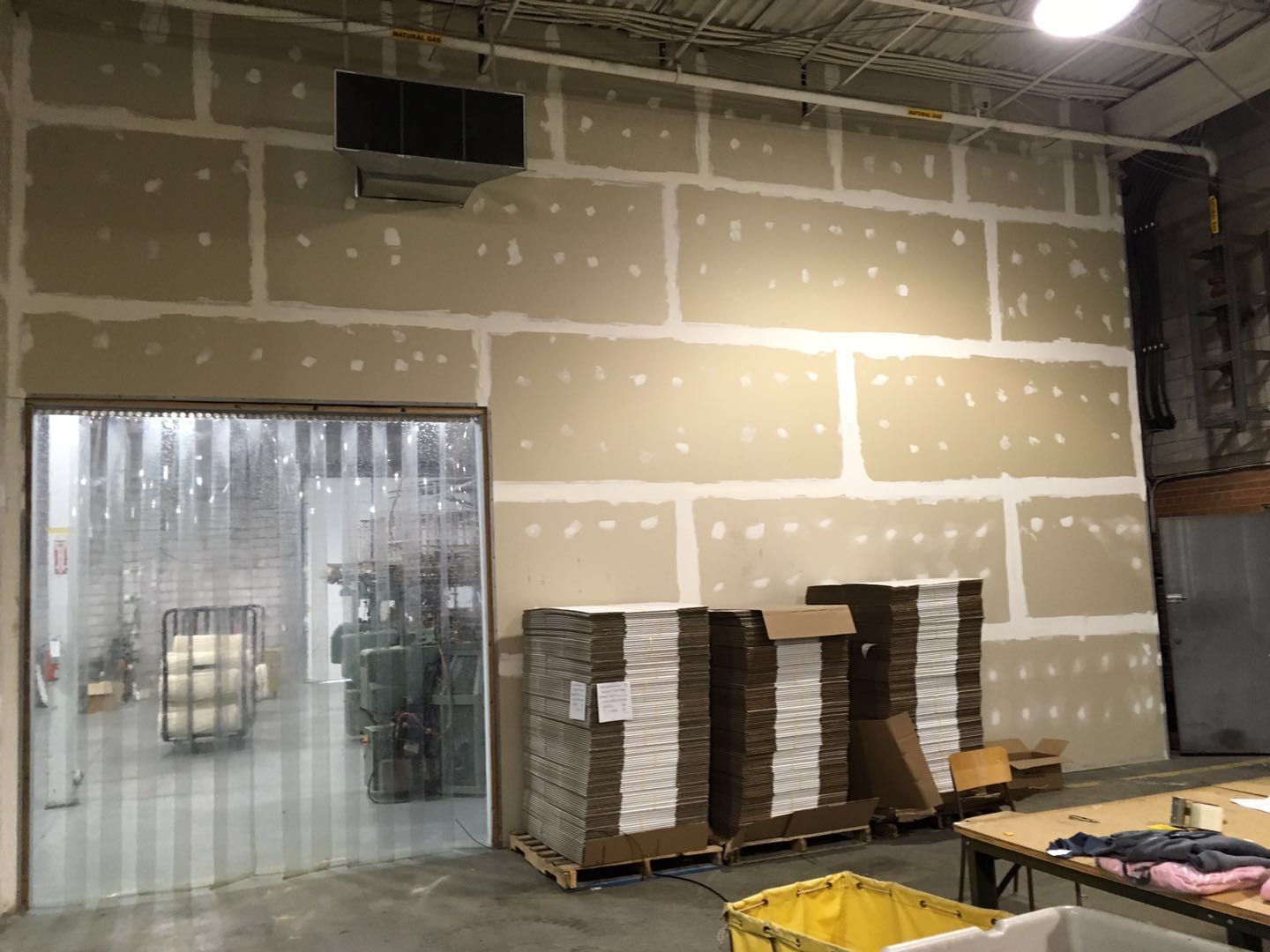 This Toronto factory renovation showcases completed drywall installation and interior wall finishing designed to improve layout, insulation, and functionality within an industrial workspace. The upgraded wall system helps define production and storage areas while maintaining a clean and organized factory environment. Completed by Reno Compass Inc., a professional Toronto renovation company specializing in commercial and industrial renovations, the project focuses on durable materials, efficient space planning, and high-quality workmanship to support long-term factory operations and productivity.