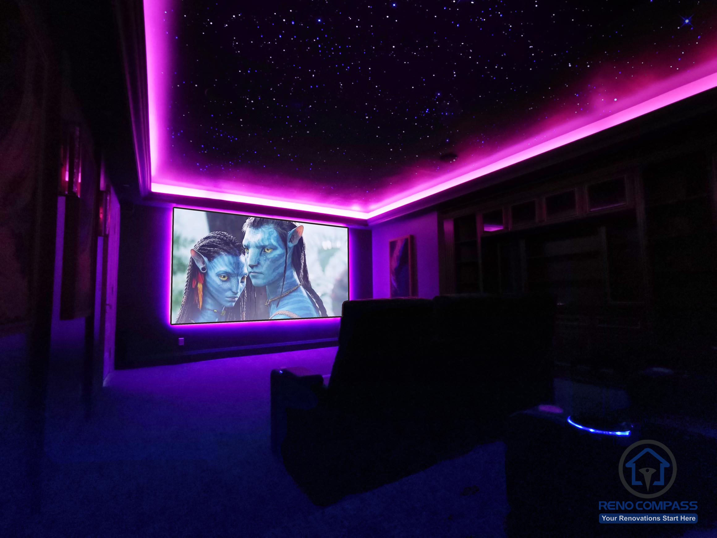Custom home theatre renovation in Aurora featuring a star ceiling, ambient LED lighting, and a large projection screen for an immersive cinematic experience.