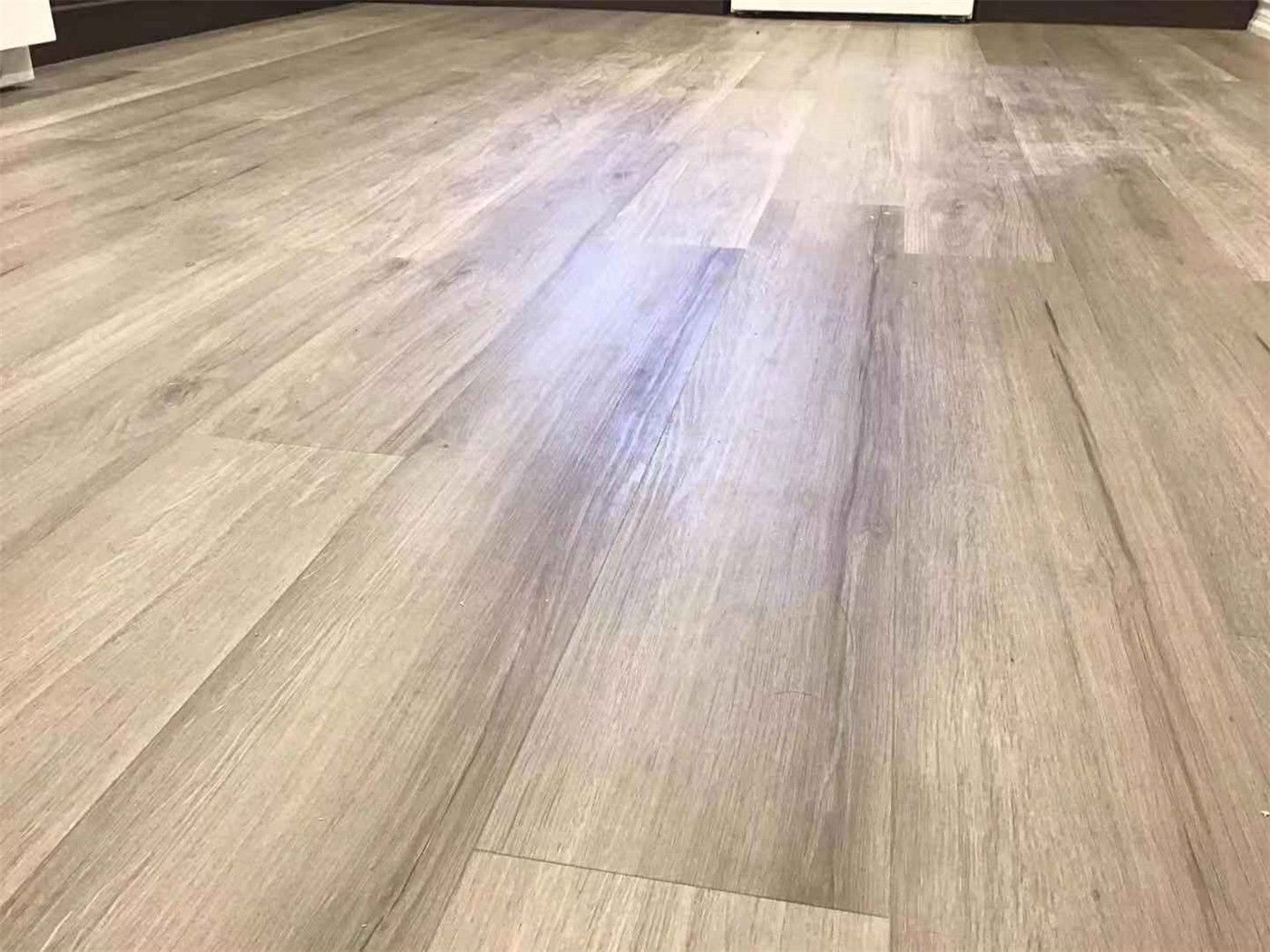 This Scarborough basement renovation features high-quality light wood-look flooring, creating a warm, clean, and modern living environment. The seamless installation enhances durability, moisture resistance, and overall aesthetic appeal, making it ideal for basement spaces. Completed by a professional Toronto Renovation Company, this project highlights both functionality and elegant design.