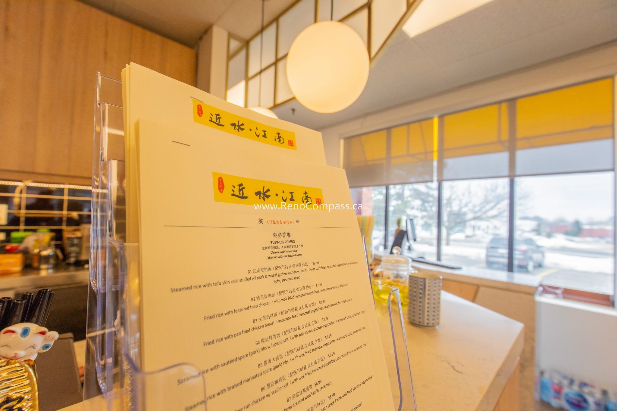 This Richmond Hill Chinese restaurant renovation by Toronto renovation company Reno Compass Inc. features a warm and modern dining interior with custom-designed tables, ceramic tableware, and elegant lighting. The upgraded restaurant space blends contemporary aesthetics with traditional Asian dining ambiance, creating a welcoming and premium customer experience. High-quality finishes, functional layout planning, and detailed craftsmanship ensure both visual appeal and operational efficiency for restaurant owners.