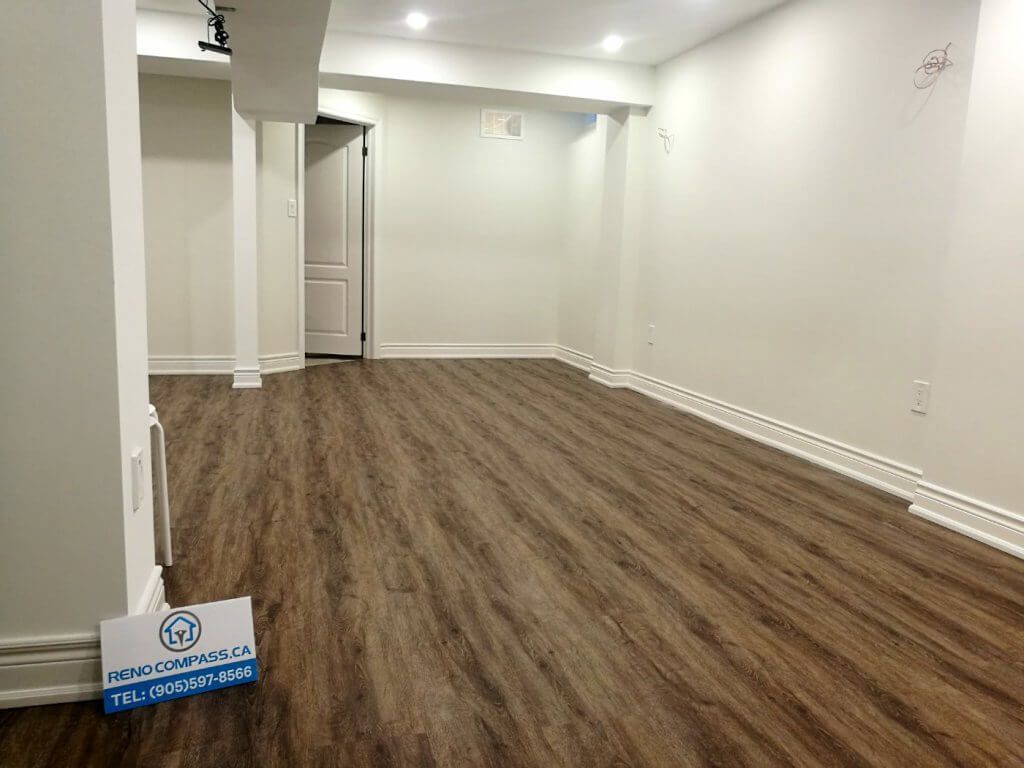 This finished basement renovation in Markham showcases a spacious open-concept layout designed for flexibility and everyday comfort. The renovation features high-quality vinyl flooring, modern recessed lighting, structural column refinishing, and a bright neutral color palette that enhances the sense of space. A newly upgraded basement bathroom and multiple storage areas improve functionality, creating a versatile lower level suitable for family living, recreation, or guest use. Completed by a trusted Toronto renovation company, this project highlights practical design and clean craftsmanship for modern homes.