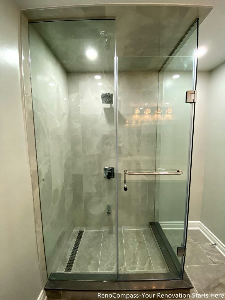 This Mississauga bathroom renovation features a walk-in shower with full-height tile walls, a clear glass enclosure, and a linear floor drain. The layout prioritizes water control, ease of cleaning, and everyday comfort while keeping the shower area visually clean and well-defined. Neutral tones and simple hardware complete the modern, practical design.
City: Mississauga · Toronto contractor: Reno Compass