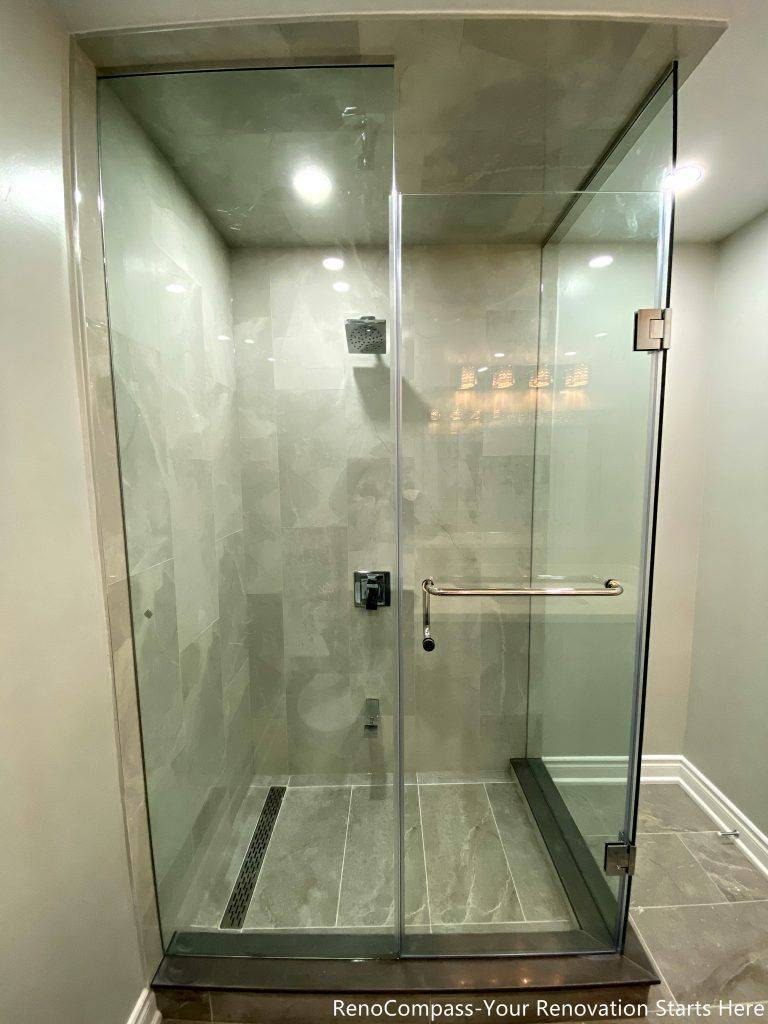 This Mississauga bathroom renovation features a walk-in shower with full-height tile walls, a clear glass enclosure, and a linear floor drain. The layout prioritizes water control, ease of cleaning, and everyday comfort while keeping the shower area visually clean and well-defined. Neutral tones and simple hardware complete the modern, practical design.
City: Mississauga · Toronto contractor: Reno Compass