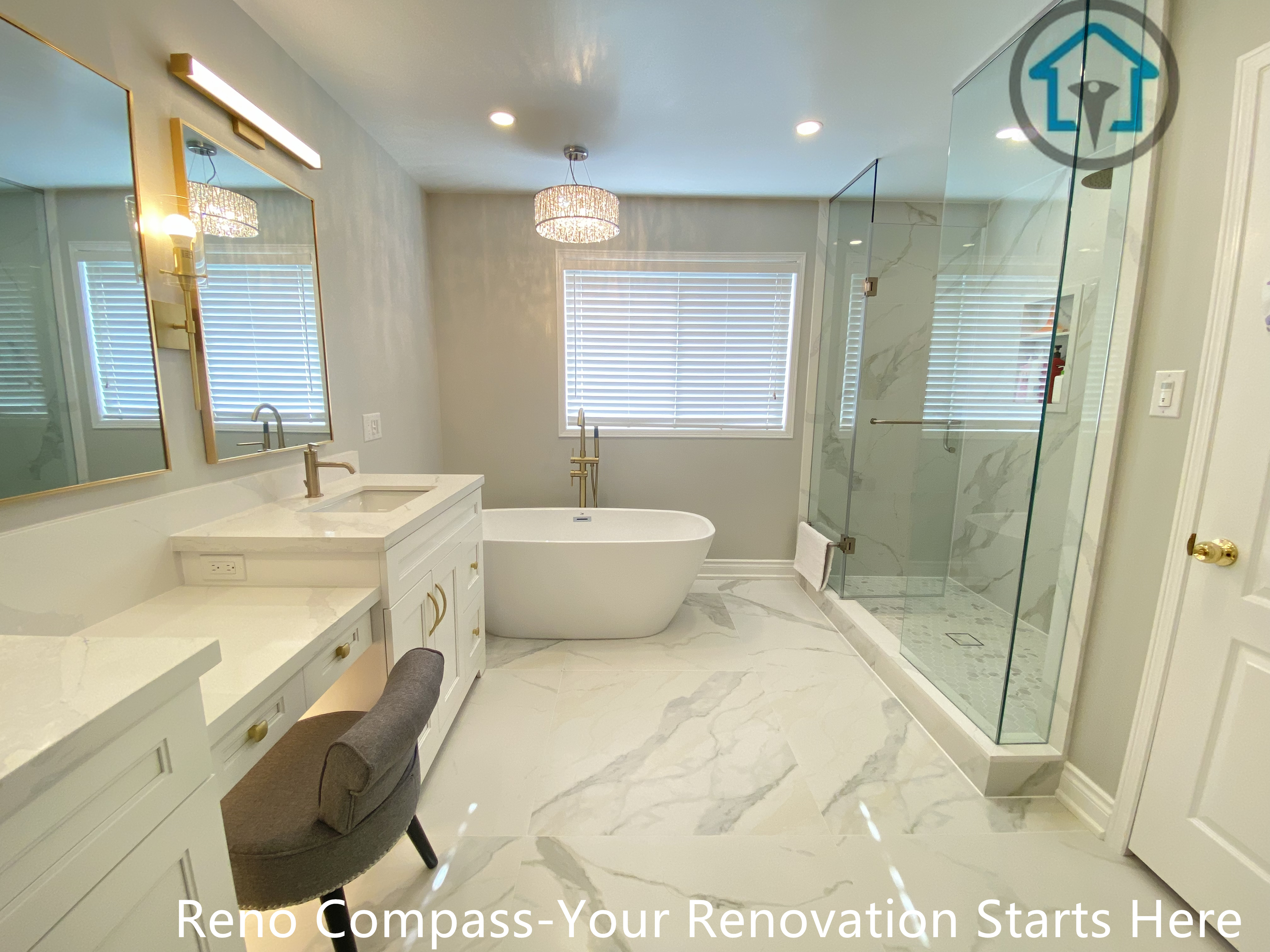 This Mississauga bathroom renovation presents a well-balanced layout combining a freestanding soaking tub, custom vanity area, and a frameless glass walk-in shower. Marble-look porcelain flooring extends throughout the space to create visual continuity and reflect natural light from the window. Gold-tone fixtures and lighting accents add warmth while maintaining a clean, modern aesthetic. The layout was carefully planned to separate wet and dry zones, improve circulation, and support long-term daily use with durable materials and precise installation.