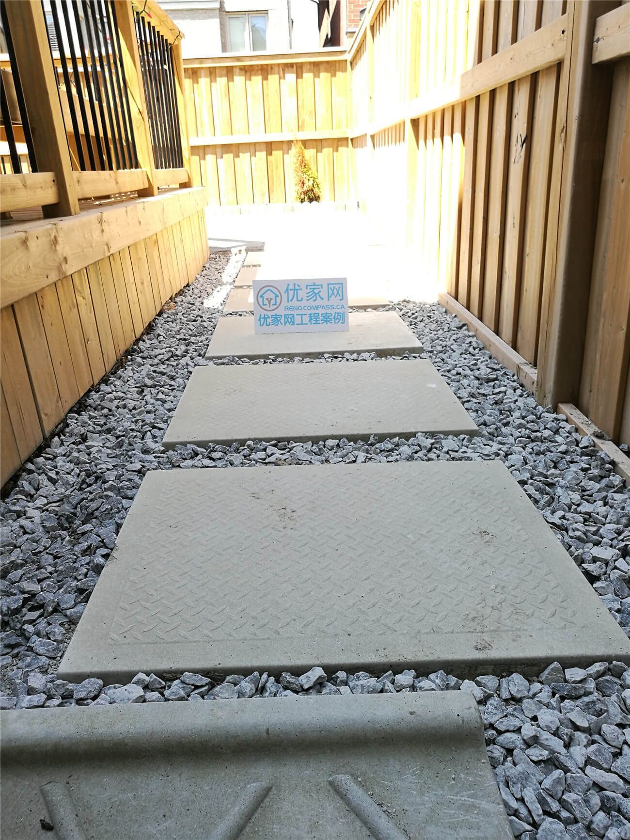 This Stouffville landscaping renovation features a clean and modern backyard walkway design using large concrete stepping stones set in decorative gravel. The narrow side yard was transformed into a functional and low-maintenance pathway, improving drainage, accessibility, and overall curb appeal. Completed by a professional Toronto landscaping and renovation team, the project enhances outdoor usability while maintaining a natural and minimalist aesthetic suitable for modern residential homes.