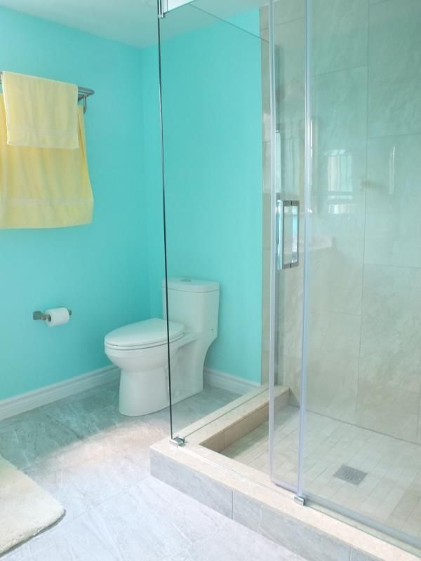 This bathroom renovation in Richmond Hill features a clean and modern interior design with a frameless glass shower enclosure, updated shower base, and a compact yet functional layout. Soft wall colors combined with bright lighting enhance the sense of space, while the upgraded toilet and tiled shower area improve both comfort and daily usability. Completed as part of a full interior renovation, this project reflects professional workmanship and practical design solutions by an experienced Toronto renovation company serving Richmond Hill homeowners.