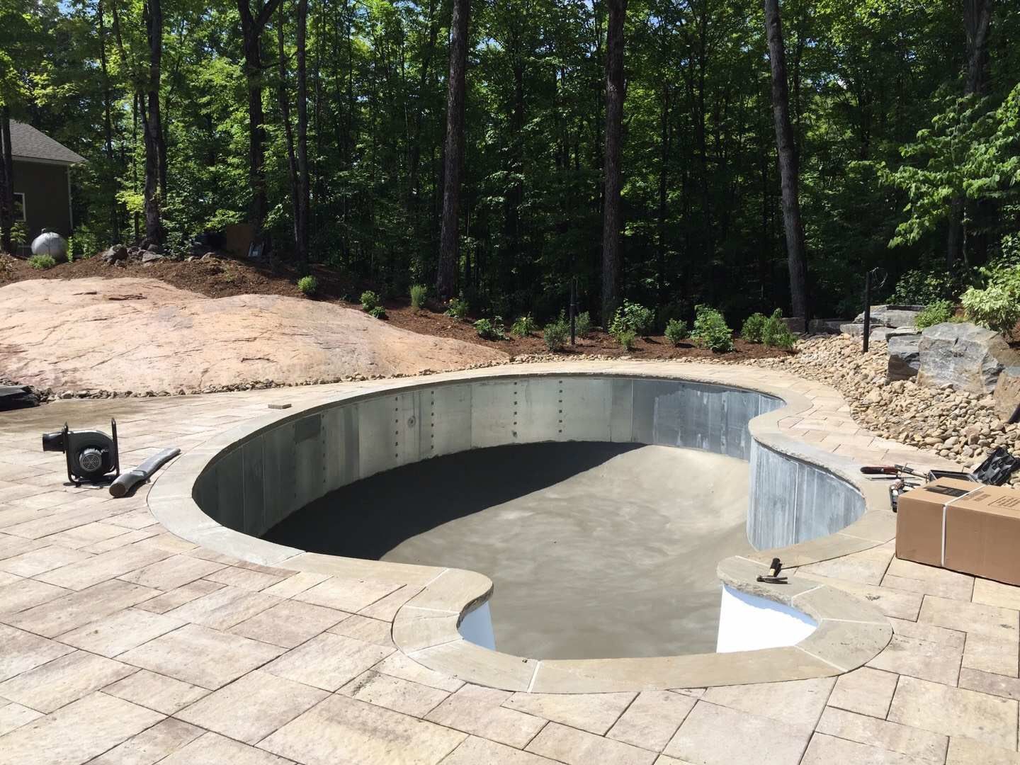 Custom backyard swimming pool construction in Toronto featuring professional steel pool structure installation and foundation preparation. This stage highlights precise pool framing, base leveling, and site grading to ensure long-term durability and structural stability for a high-quality residential swimming pool project.