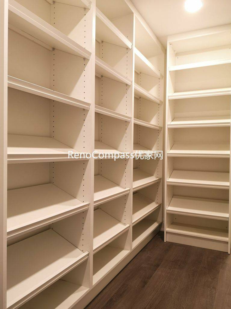 Custom walk-in basement storage room renovation in Richmond Hill featuring full-height built-in shelving, durable flooring, and bright recessed lighting. Completed by Reno Compass Inc., this organized storage space maximizes functionality and home value.