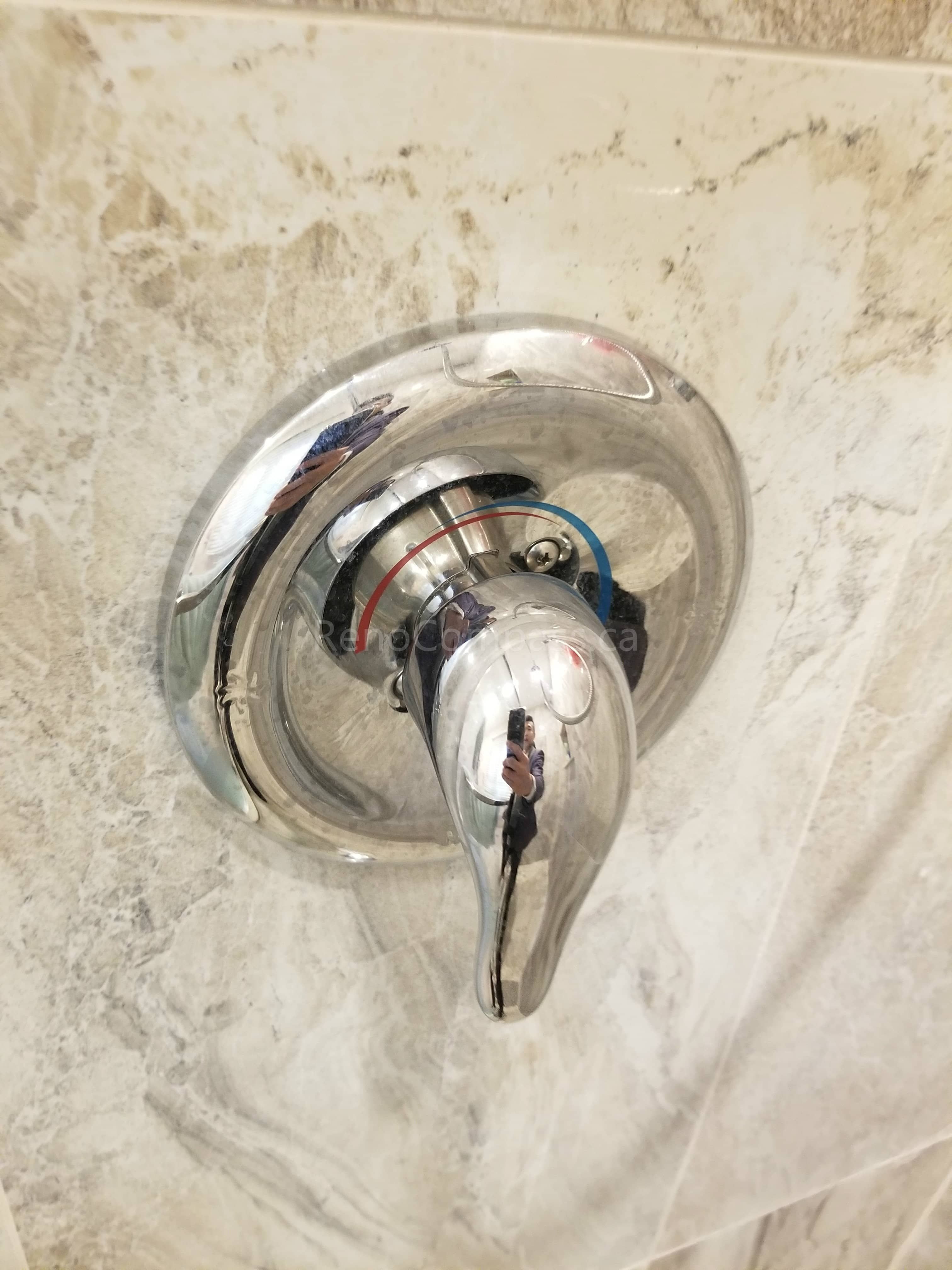 As part of this Markham bathroom renovation, a modern shower faucet and temperature control valve were professionally installed to enhance functionality and user comfort. The upgraded fixture complements the new wall tiles and shower system, offering smooth water control, improved durability, and a clean contemporary finish that elevates the overall bathroom design.