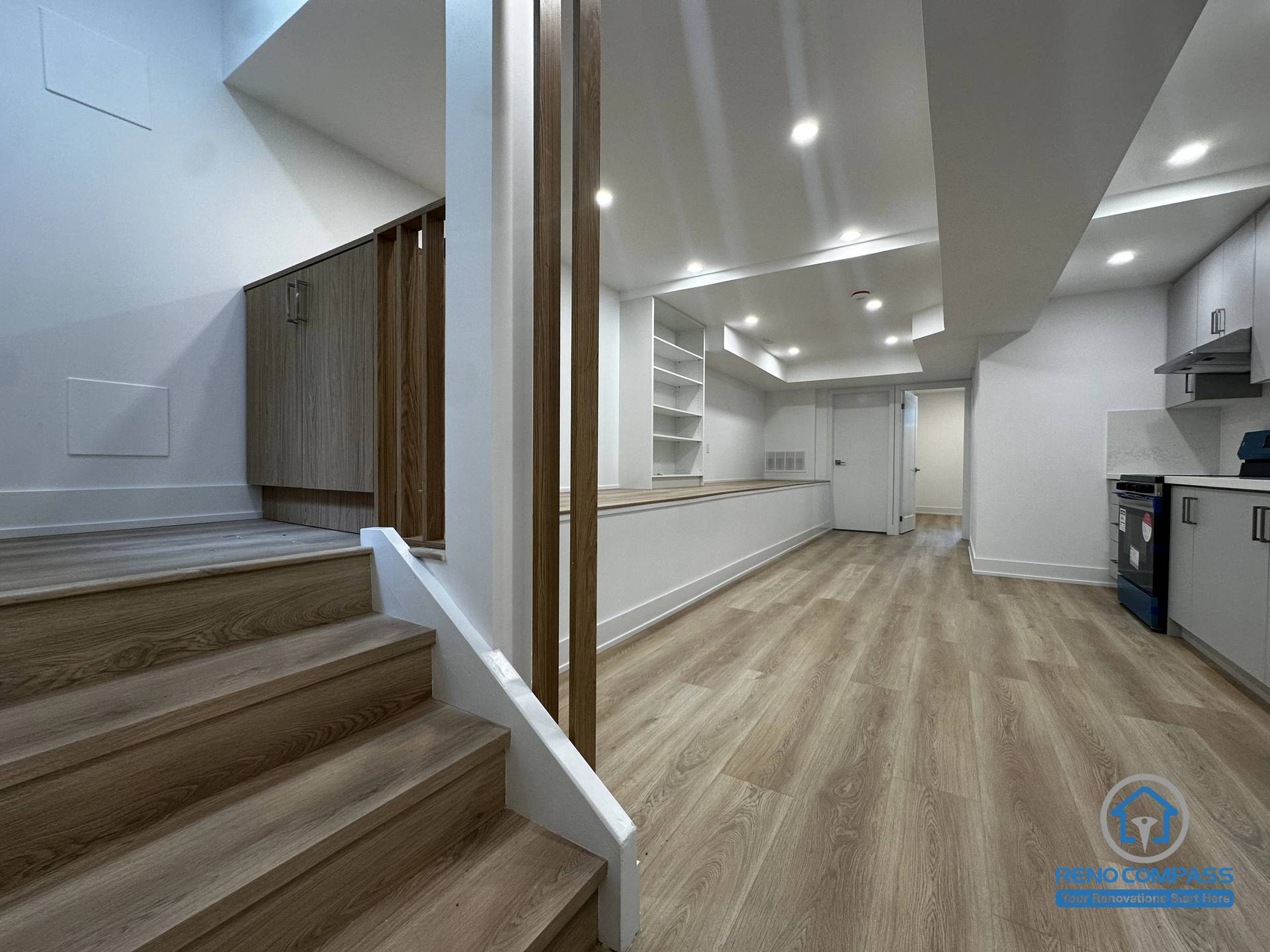 This basement unit layout showcases the connection between the staircase access and the open living space in a Toronto legal 3-unit conversion. The design clearly separates levels while maintaining functional flow, creating an independent and fully livable rental unit.