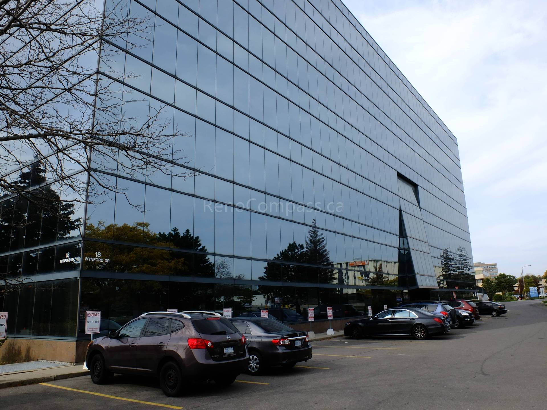 This image captures the exterior of the North York office building undergoing renovation. The modern glass façade reflects the clean, professional design style that continues throughout the renovated interior spaces. Reno Compass handled both exterior coordination and interior office upgrades to deliver a cohesive, efficient business environment.