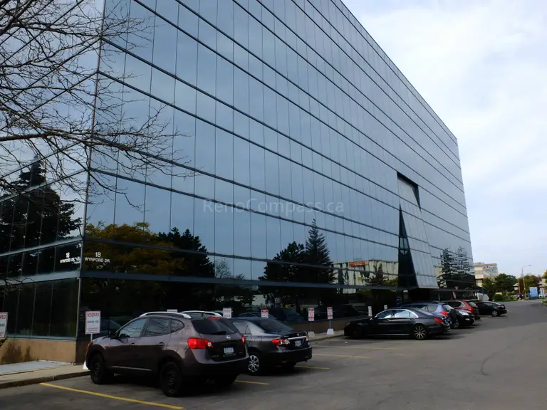 This image captures the exterior of the North York office building undergoing renovation. The modern glass façade reflects the clean, professional design style that continues throughout the renovated interior spaces. Reno Compass handled both exterior coordination and interior office upgrades to deliver a cohesive, efficient business environment.
