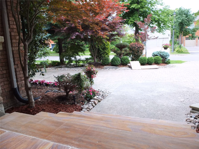 This Richmond Hill front entrance renovation showcases a newly installed interlocking stone porch with durable natural-tone tiles and clean modern finishing. The upgraded entrance landing improves safety, drainage, and curb appeal while complementing the home’s brick exterior and stone pillars. Completed by a trusted Toronto renovation company, this landscaping and interlocking project delivers a refined, long-lasting front entry designed for both functionality and visual impact.
