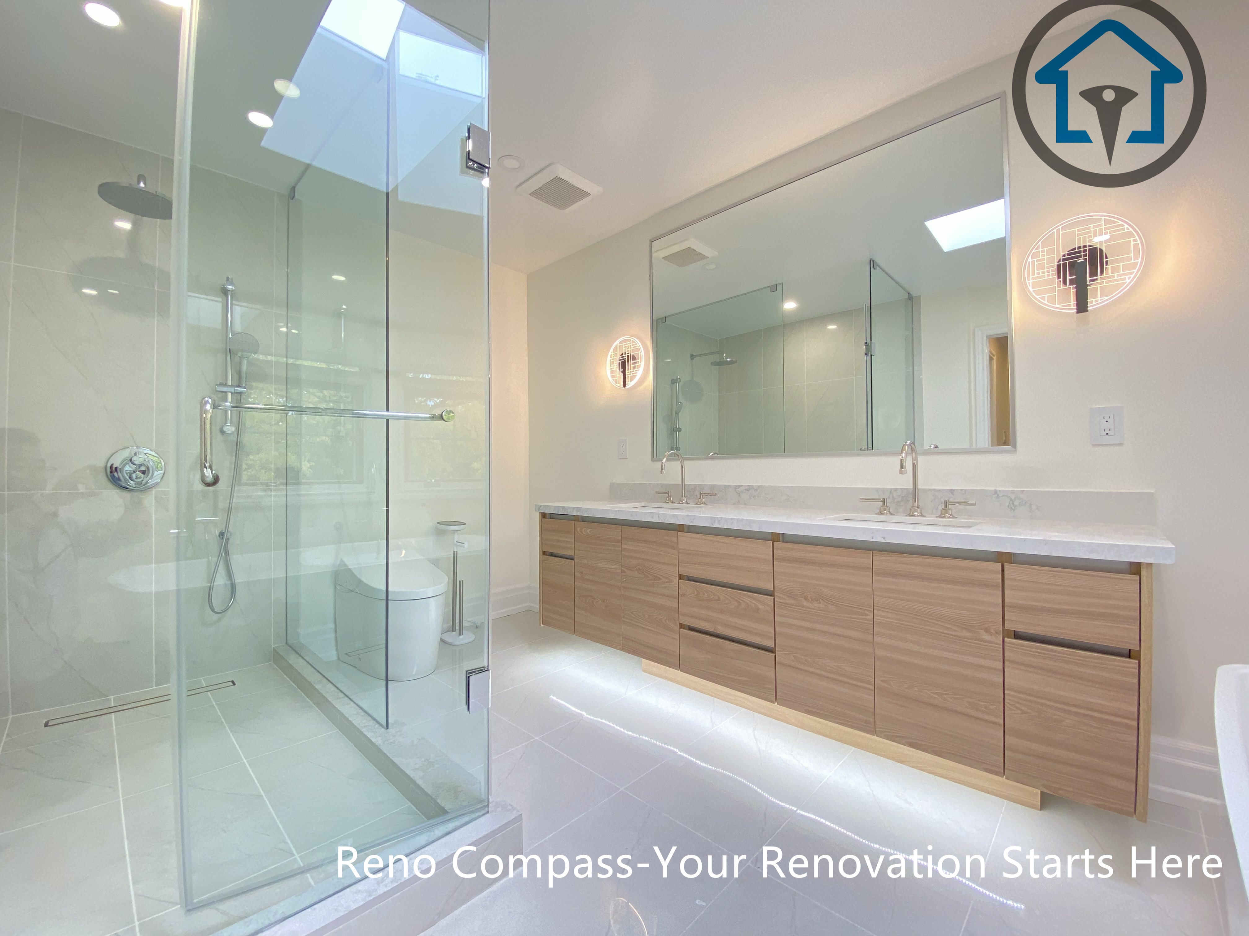 This bathroom detail highlights a custom floating vanity with integrated LED under-lighting, paired with a glass-enclosed shower for a clean and refined finish. Part of a modern bathroom renovation completed in Thornhill by Reno Compass.