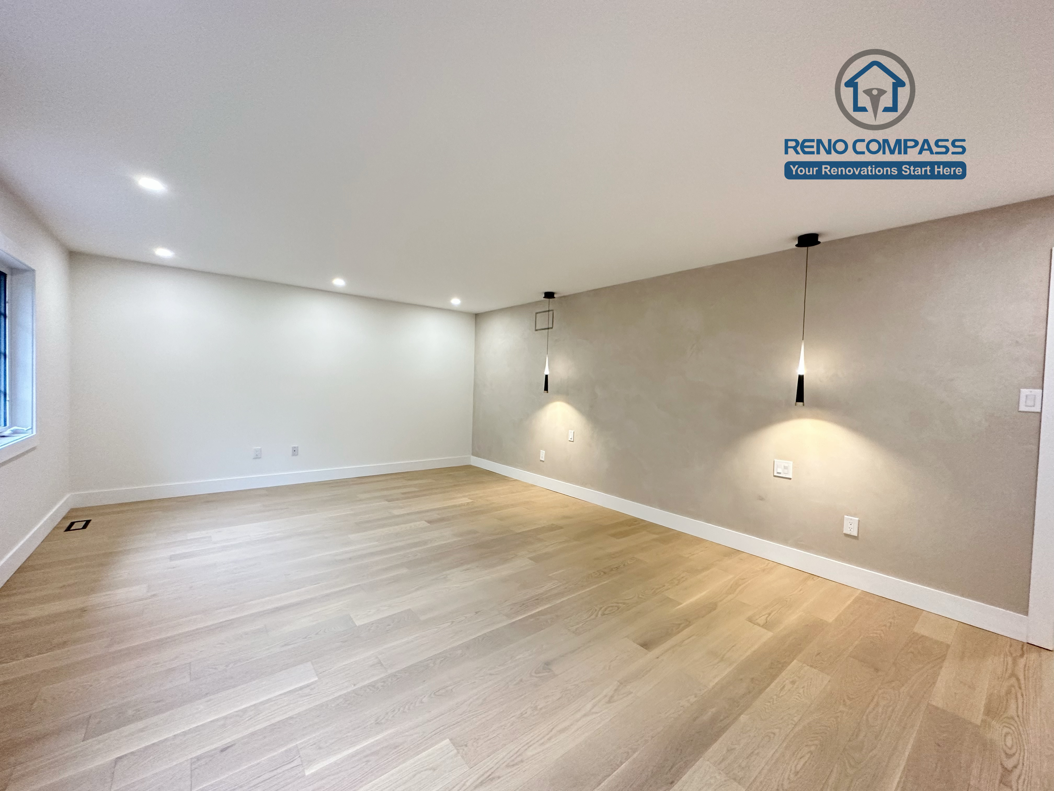 Modern bedroom renovation in a Richmond Hill home featuring light-tone hardwood flooring, minimalist pendant accent lighting, clean white walls, and a sleek, contemporary interior finish.