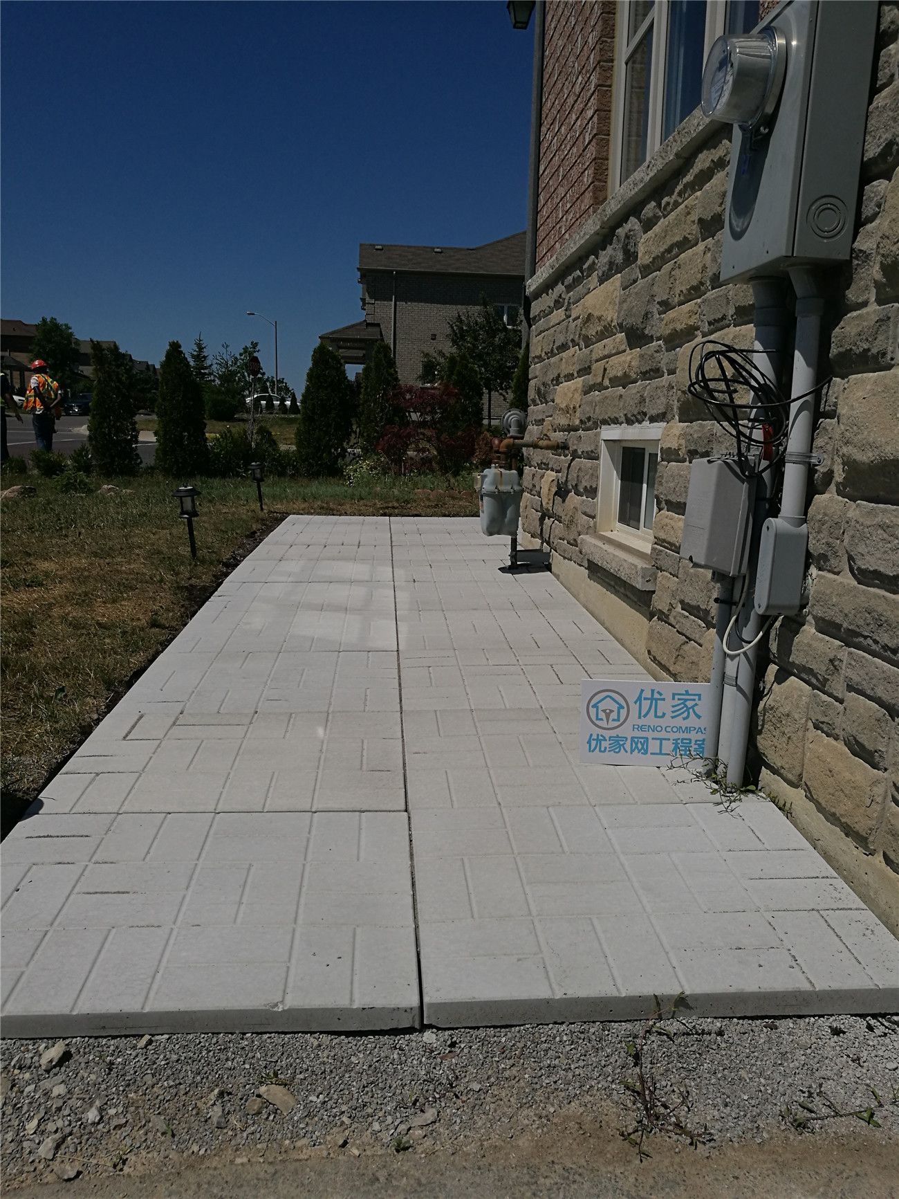A professionally installed side yard interlock walkway in Vaughan, featuring light-toned concrete pavers for a clean, durable, and low-maintenance pathway. This interlocking stone walkway improves drainage, accessibility, and usability along the side of the home while enhancing the overall landscape design. A practical hardscape solution for Vaughan residential landscaping projects.