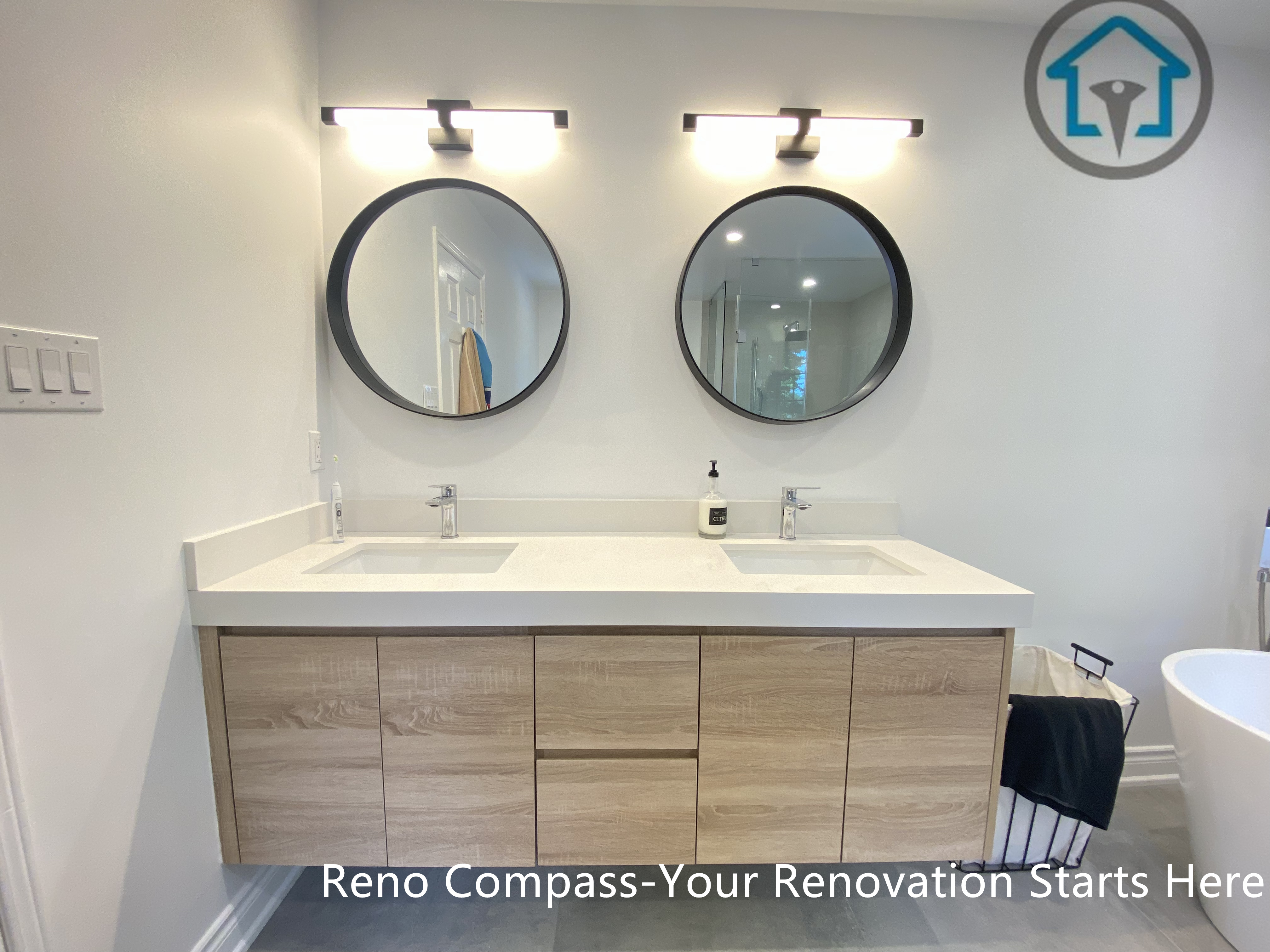 This Oakville bathroom renovation highlights a sleek walk-in shower with a frameless glass enclosure and large-format grey tiles. A recessed wall niche provides practical storage while keeping the shower area clean and uncluttered. The minimalist design and durable materials make the space easy to maintain and well suited for long-term daily use.