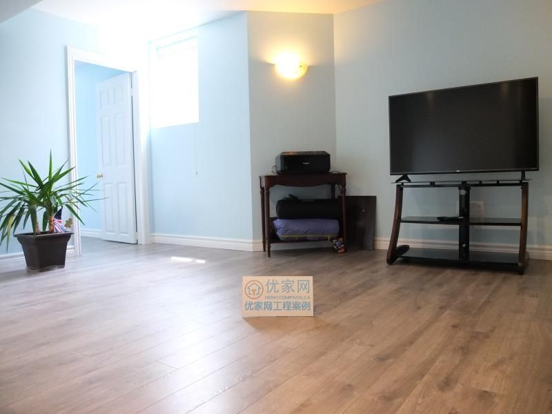 This interior renovation project in Richmond Hill features a bright and open living area finished with modern wood-look flooring and freshly painted walls. The updated lighting and clean layout improve natural light flow and make the space suitable for a family room, entertainment area, or multi-purpose living space. As part of a full interior renovation, this upgrade highlights functional planning and quality finishes delivered by a professional Toronto renovation company serving Richmond Hill homeowners.