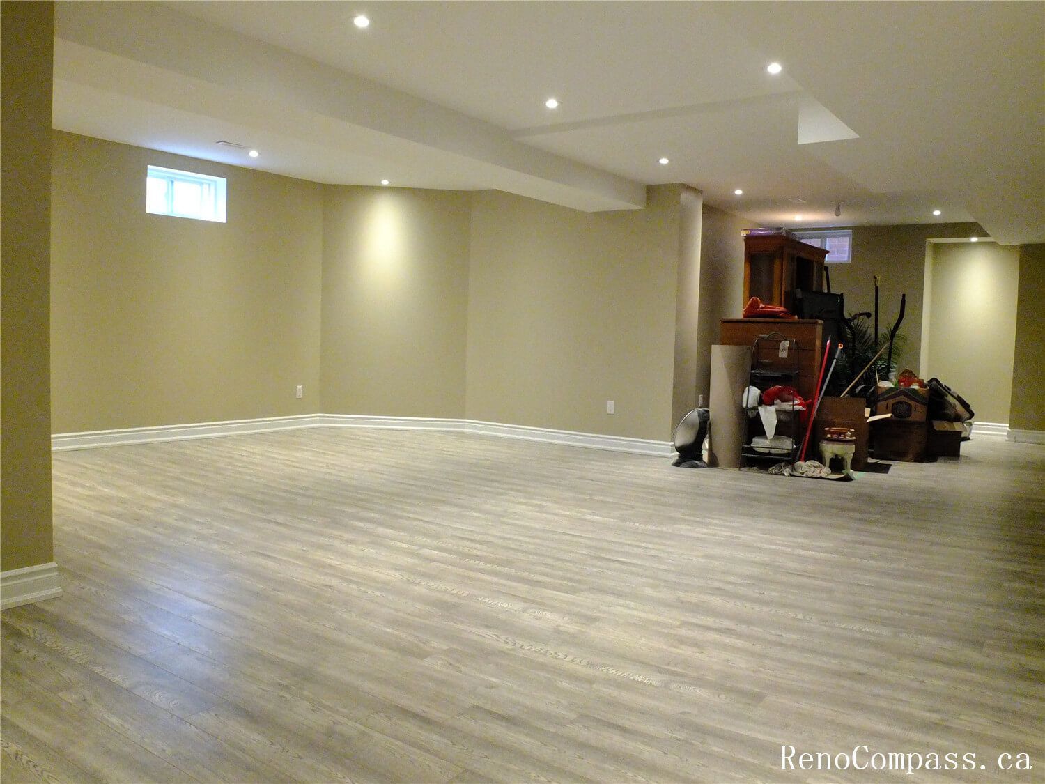 A professional basement finishing project in Ajax featuring high-quality vinyl plank flooring, recessed pot lighting, and a spacious open-concept layout. Perfect for a home gym, playroom, or entertainment area.