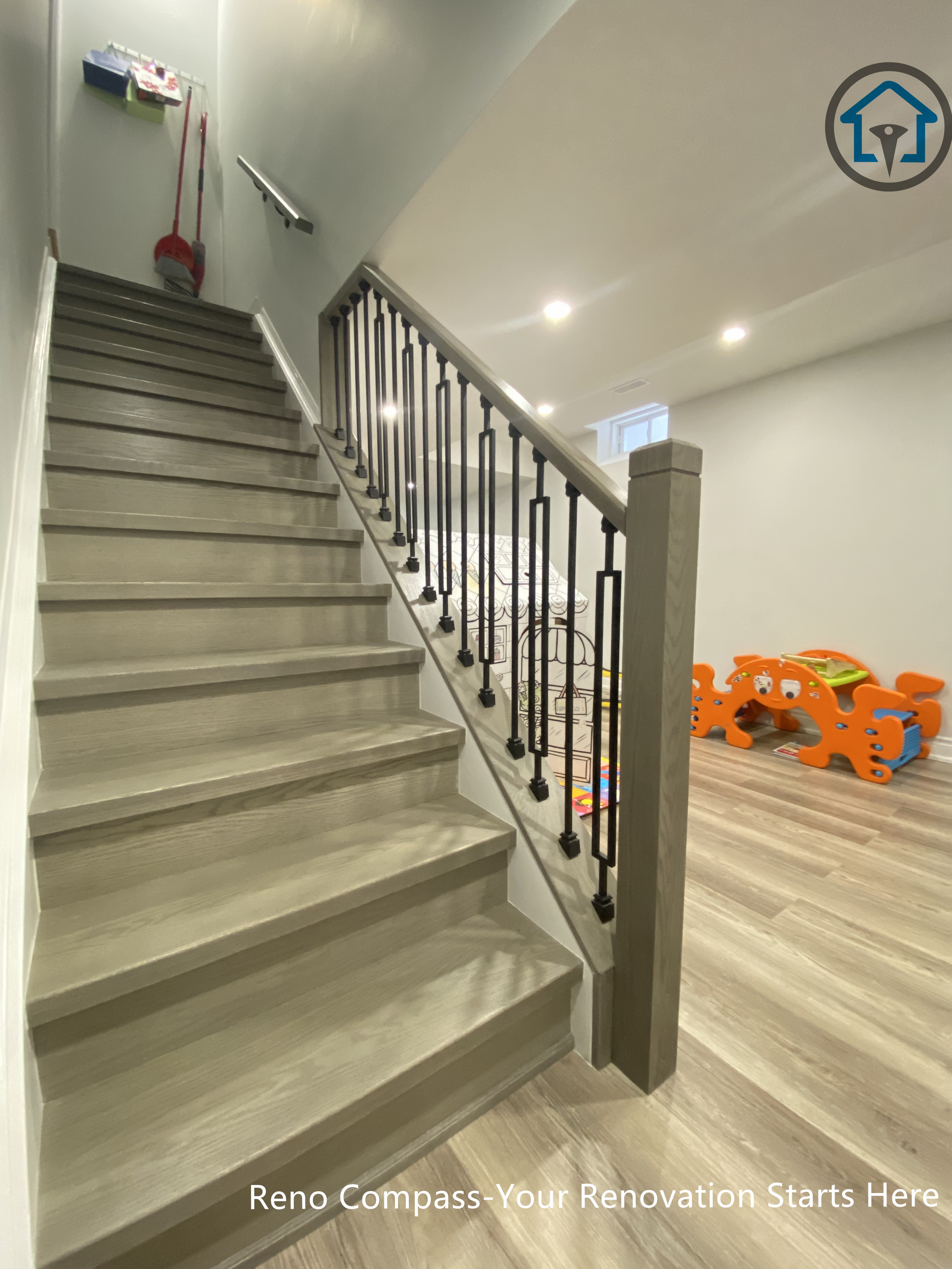 Detailed view of basement staircase finishing in Vaughan, highlighting clean handrail installation and precise construction workmanship.