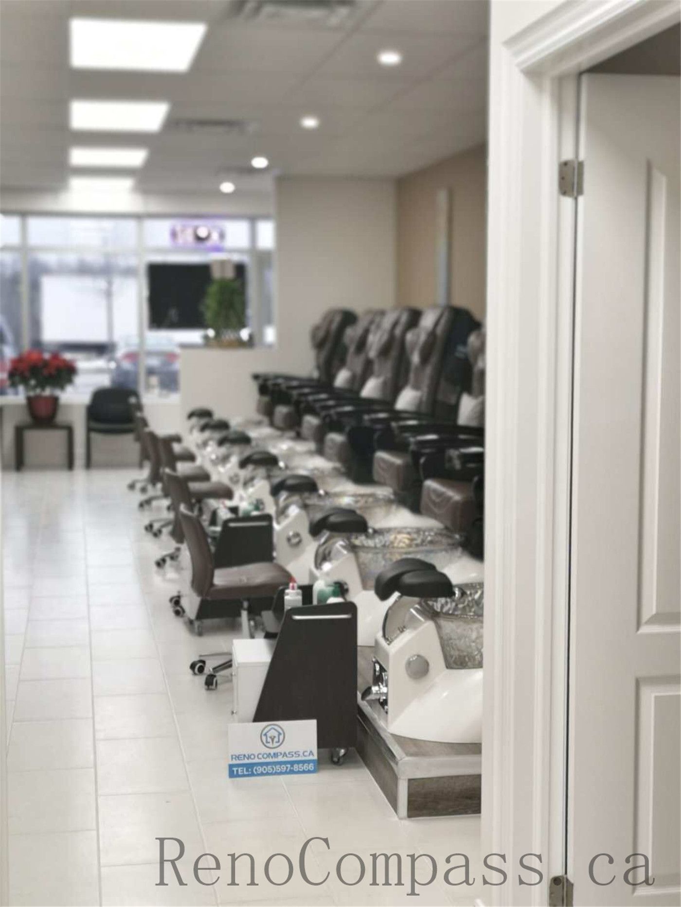 Professional Toronto nail salon commercial renovation showcasing a spacious pedicure area with multiple luxury massage chairs, modern spa basins, and a bright open layout. The upgraded beauty space focuses on customer comfort, efficient workflow, and a clean contemporary design ideal for high-end nail spa operations. Completed by Reno Compass Inc., a trusted Toronto renovation company specializing in nail salon and commercial interior renovations.