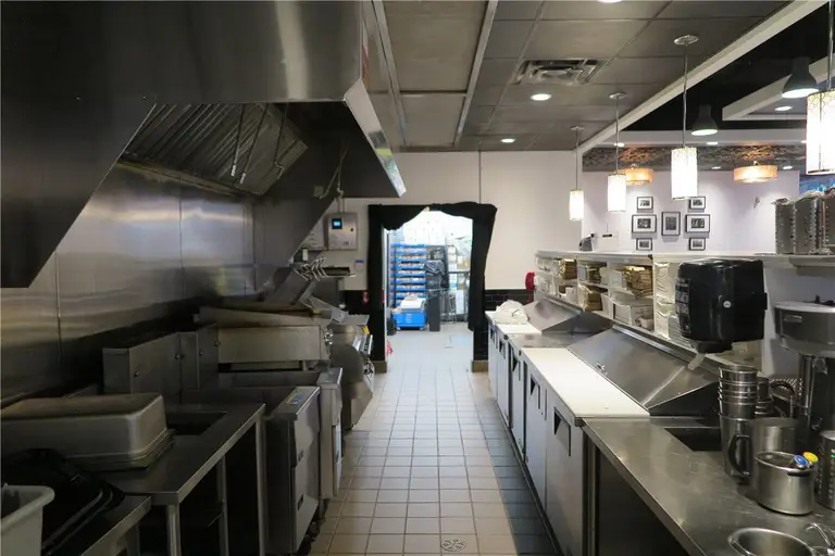 This Toronto restaurant renovation project showcases a fully upgraded commercial kitchen and front service counter area completed by Reno Compass Inc. The scope of work included stainless steel prep stations, commercial-grade ventilation hood installation, new ceiling lighting, POS counter setup, and optimized kitchen workflow layout.

The redesigned space improves operational efficiency, hygiene standards, and customer service flow. Durable flooring, modern pendant lighting, and professional-grade equipment installation ensure the restaurant meets commercial safety codes while maintaining a clean and contemporary appearance.

As a trusted Toronto renovation company, Reno Compass Inc. delivers practical and code-compliant restaurant renovation solutions tailored for food service businesses across the GTA.