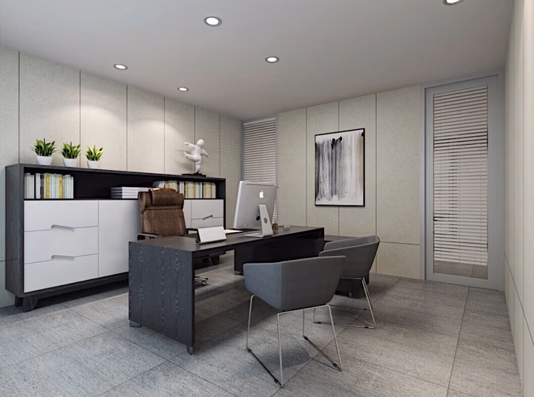 This Toronto office commercial renovation features a modern executive private office designed with clean lines and a professional layout. The space includes a contemporary desk, comfortable guest seating, custom storage cabinets, and minimalist décor to create a functional and organized work environment. Neutral wall panels, recessed ceiling lighting, and modern furnishings enhance both productivity and visual appeal. Completed by Reno Compass Inc., a trusted Toronto Renovation Company specializing in commercial office renovation and workspace interior design.