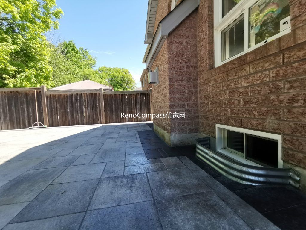 Modern backyard patio interlocking project completed in Mississauga featuring large-format stone pavers and clean border detailing. This professionally installed outdoor space enhances durability, drainage, and functionality, creating a spacious and low-maintenance patio ideal for everyday outdoor living and entertaining.