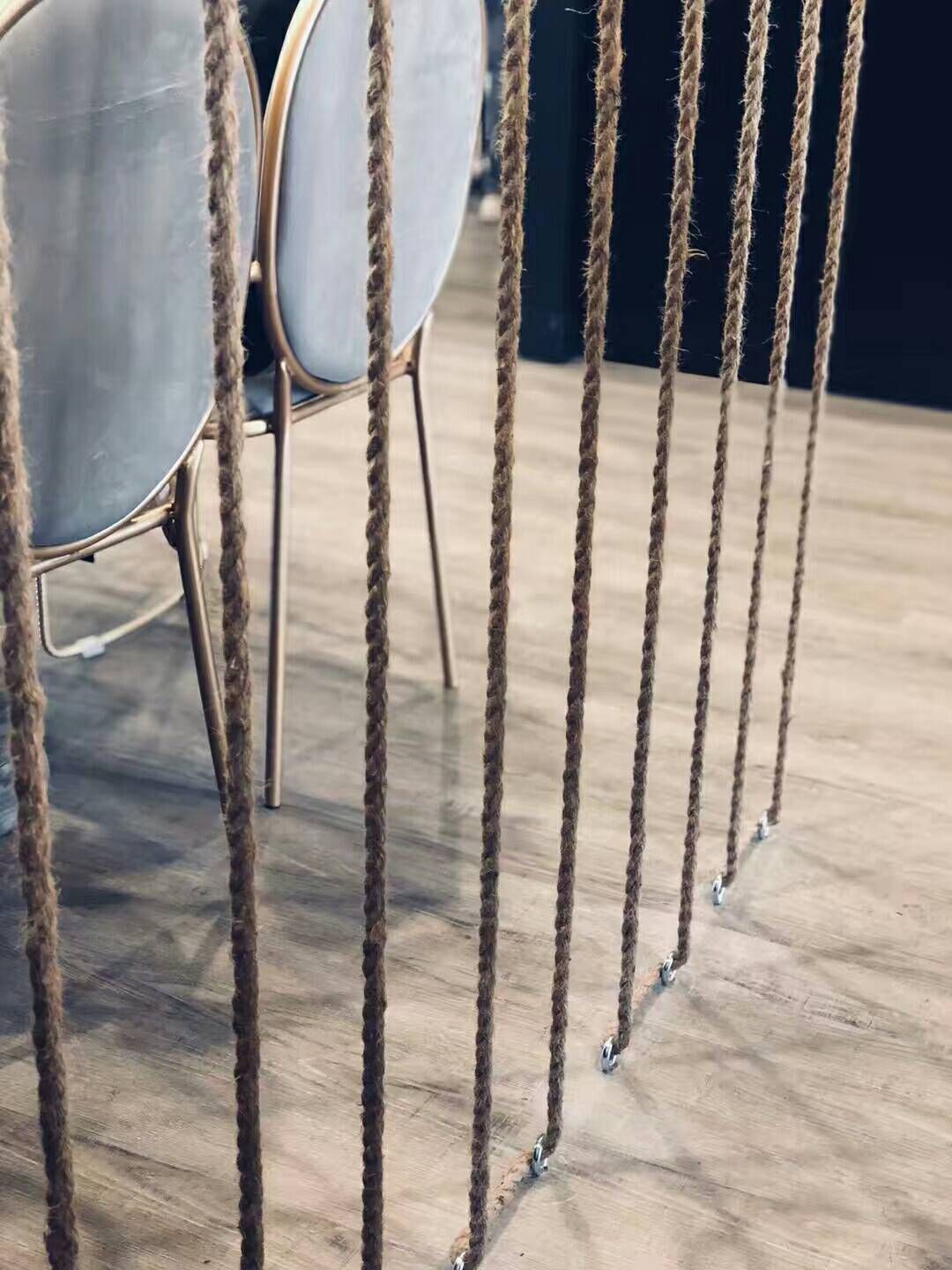 This image highlights a unique interior design feature from a Scarborough bubble tea shop renovation project. Decorative rope dividers were installed to create a stylish visual separation within the seating area while maintaining an open and modern layout. The natural rope elements combined with warm-toned flooring add texture and character to the commercial space, enhancing the overall atmosphere of the bubble tea shop. The renovation reflects thoughtful design details that balance aesthetics and functionality for a welcoming customer environment.