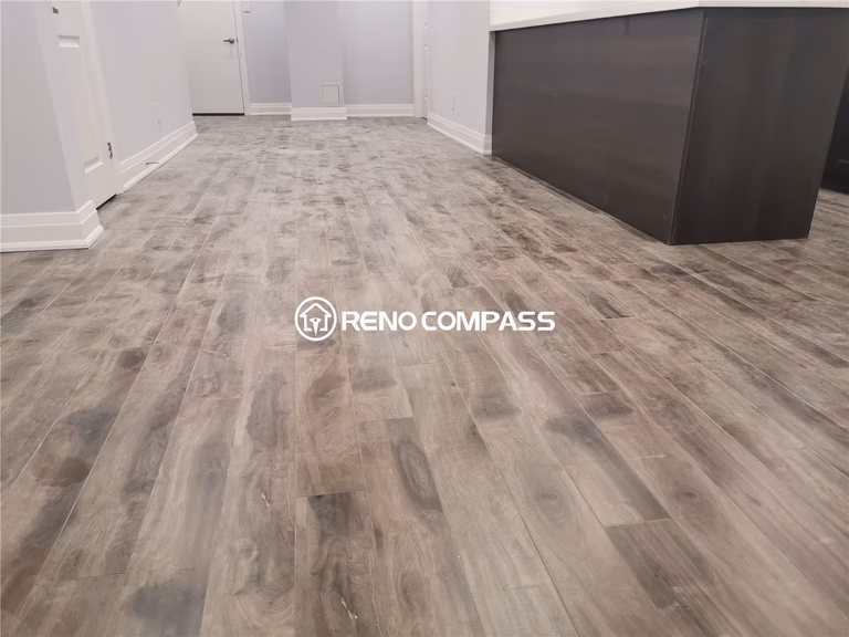 This Markham basement renovation showcases newly installed waterproof vinyl plank flooring designed for durability, comfort, and modern aesthetics. The wood-look flooring enhances the warmth of the basement space while providing moisture resistance ideal for long-term basement use. Clean baseboard finishing, neutral wall tones, and an open layout create a functional and inviting environment for family living or rental potential. Completed by a professional Toronto renovation company, this project highlights precise flooring installation, detailed craftsmanship, and practical basement remodeling tailored for homes in the Greater Toronto Area.