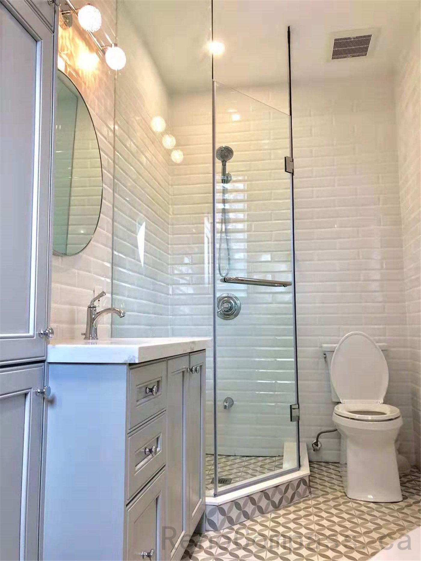 This North York bathroom renovation features a modern glass shower enclosure with marble-look wall tiles, a custom vanity with quartz countertop, and coordinated brushed metal fixtures. The bright layout enhances space, functionality, and everyday comfort while maintaining a clean contemporary style. Completed by a professional Toronto renovation company focused on quality craftsmanship and refined bathroom design.
