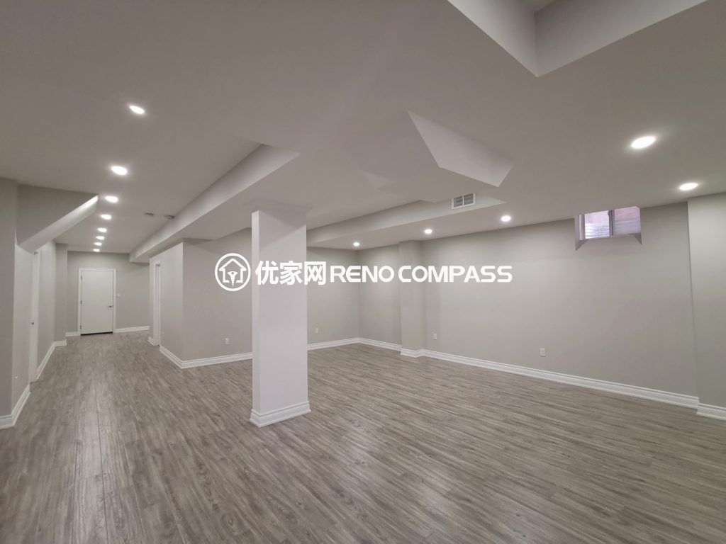This Vaughan basement renovation features a fully finished open-concept layout designed for flexibility and modern living. The space includes new durable flooring, smooth ceiling finishing with pot lights, and clean structural column integration to create a bright and functional environment. Completed by a trusted Toronto renovation company, this basement transformation enhances usable living space while adding long-term comfort, value, and contemporary style to the home.