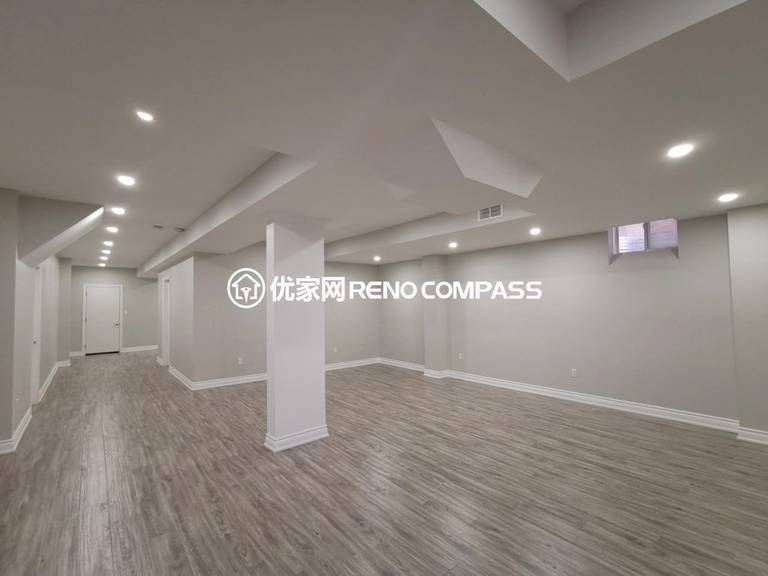 This Vaughan basement renovation features a fully finished open-concept layout designed for flexibility and modern living. The space includes new durable flooring, smooth ceiling finishing with pot lights, and clean structural column integration to create a bright and functional environment. Completed by a trusted Toronto renovation company, this basement transformation enhances usable living space while adding long-term comfort, value, and contemporary style to the home.