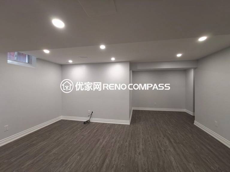 Richmond Hill basement interior renovation featuring new waterproof flooring, recessed pot lights, and a clean open-concept layout. The upgraded space offers bright lighting, modern finishes, and flexible functionality for family living or entertainment, completed by a professional Toronto renovation company.