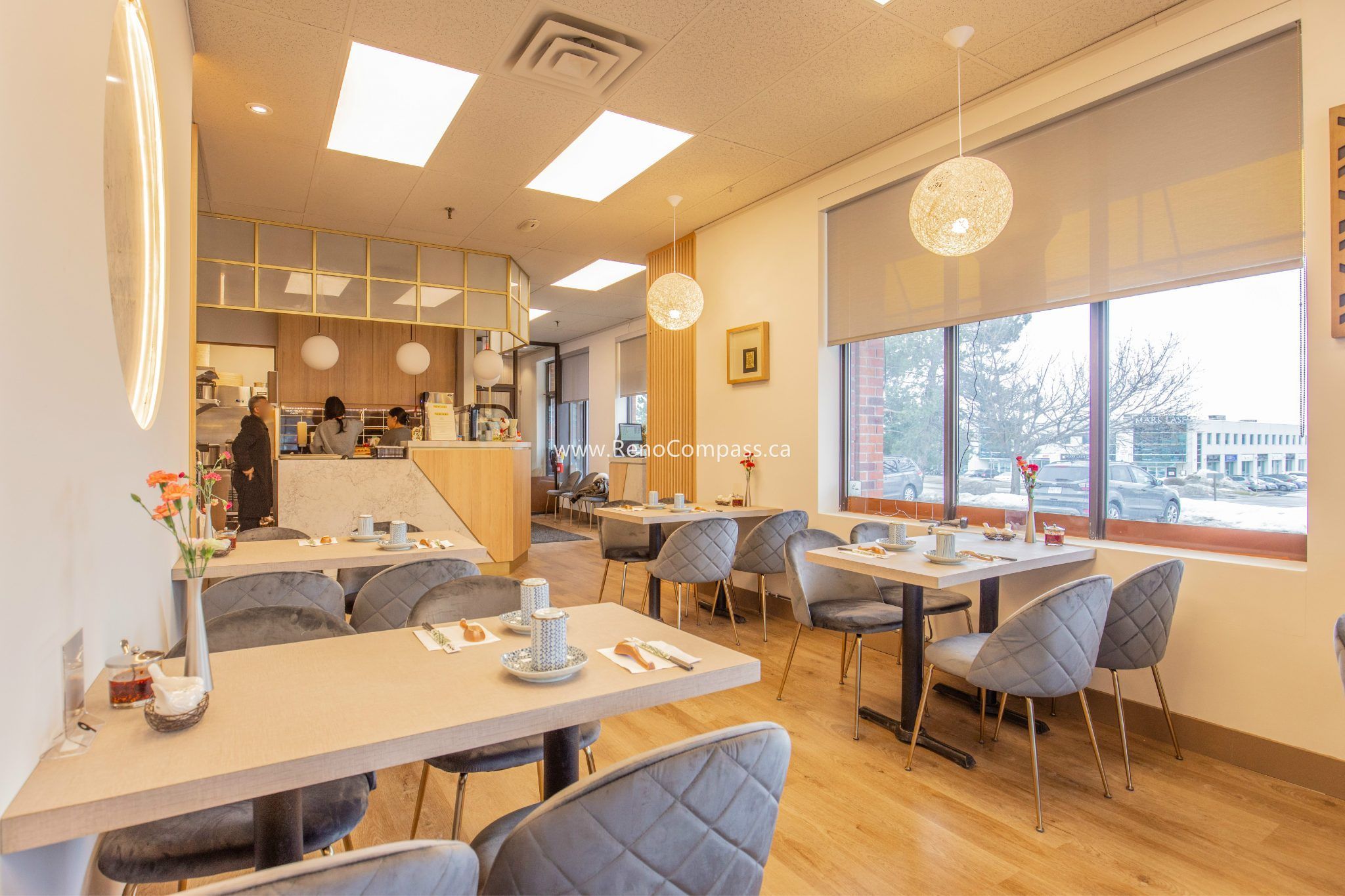 This Richmond Hill Chinese restaurant renovation by Toronto renovation company Reno Compass Inc. features a bright and welcoming entrance and waiting area designed to enhance customer experience. The upgraded space includes modern wood flooring, custom wall paneling, elegant lighting, and organized seating to create a clean and comfortable dining environment. Thoughtful layout planning improves traffic flow from entrance to dining area, while contemporary finishes elevate the restaurant’s overall brand image and functionality for daily operations.