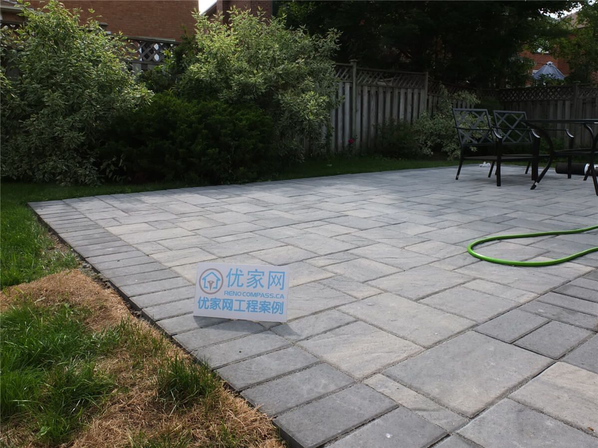 This Toronto backyard landscaping project features a professionally installed interlocking stone patio with a clean, modern layout. The new outdoor space provides a durable and stylish seating area, surrounded by refreshed lawn and greenery for a functional and inviting backyard environment. Completed by Reno Compass, this project highlights quality craftsmanship in patio construction and garden landscaping for Toronto homeowners seeking beautiful and low-maintenance outdoor living spaces.