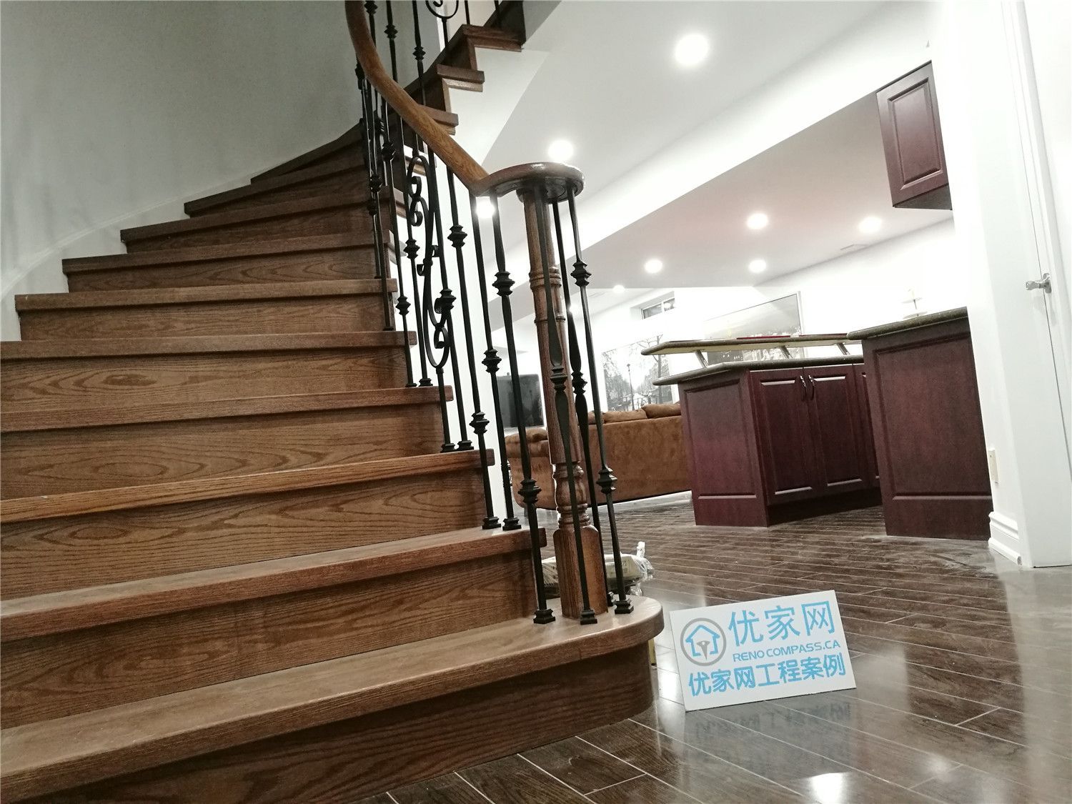 This Markham staircase renovation showcases elegant hardwood steps paired with custom black iron railings, creating a timeless transition between the main floor and the newly renovated basement. The rich wood tones complement the dark flooring and built-in bar area, delivering a cohesive and upscale interior finish. Enhanced with recessed lighting and detailed craftsmanship, this staircase upgrade improves both safety and visual impact while adding long-term value to the home. A professionally completed basement and stair renovation designed for modern living in Markham.