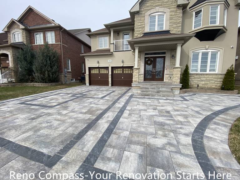 Completed interlocking driveway renovation in Newmarket featuring a large-scale front yard hardscape with patterned concrete pavers and contrasting border lines. The upgraded driveway enhances curb appeal, provides a durable parking surface, and complements the home’s exterior architecture. Designed and installed by a trusted Toronto renovation company specializing in high-quality residential exterior renovations.