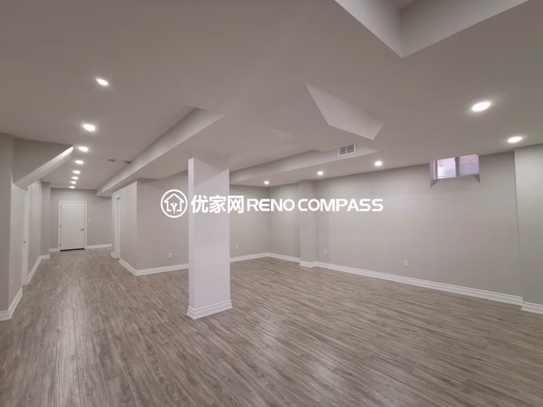 This Vaughan basement renovation features a fully finished open-concept layout designed for flexibility and modern living. The space includes new durable flooring, smooth ceiling finishing with pot lights, and clean structural column integration to create a bright and functional environment. Completed by a trusted Toronto renovation company, this basement transformation enhances usable living space while adding long-term comfort, value, and contemporary style to the home.